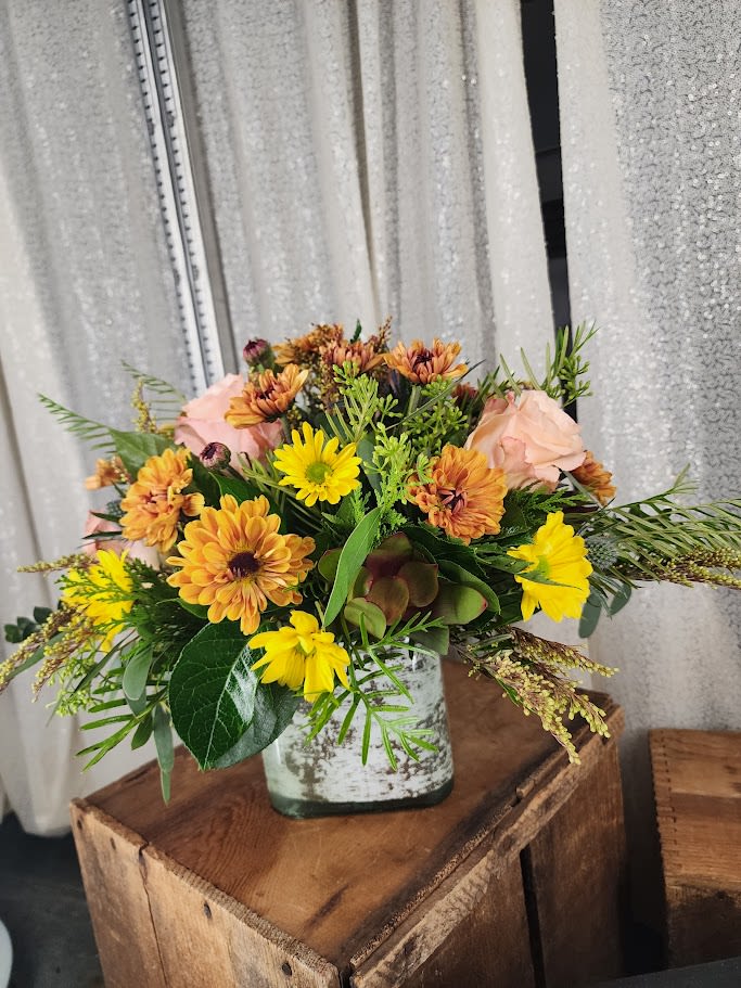 Autumn Birch Bliss Autumn Birch Bliss - Celebrate the warmth of the season with Autumn Birch Bliss, a stunning bouquet rooted in the rustic charm of a natural birch base. This arrangement overflows with rich, fall-inspired blooms in golden yellows, deep reds, and burnt oranges—capturing the essence of crisp autumn days and cozy gatherings. Perfect as a centerpiece or heartfelt gift, this bouquet brings the beauty of fall indoors with elegance and charm.