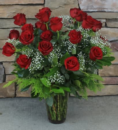 Two dozen red roses - 24 red roses arranged with filler and greenery in a vase. 