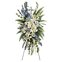 Eternal Grace - A touching display of devotion, this peaceful spray of white and light blue flowers is accompanied by an elegant crystal cross keepsake that will be cherished for years to come.