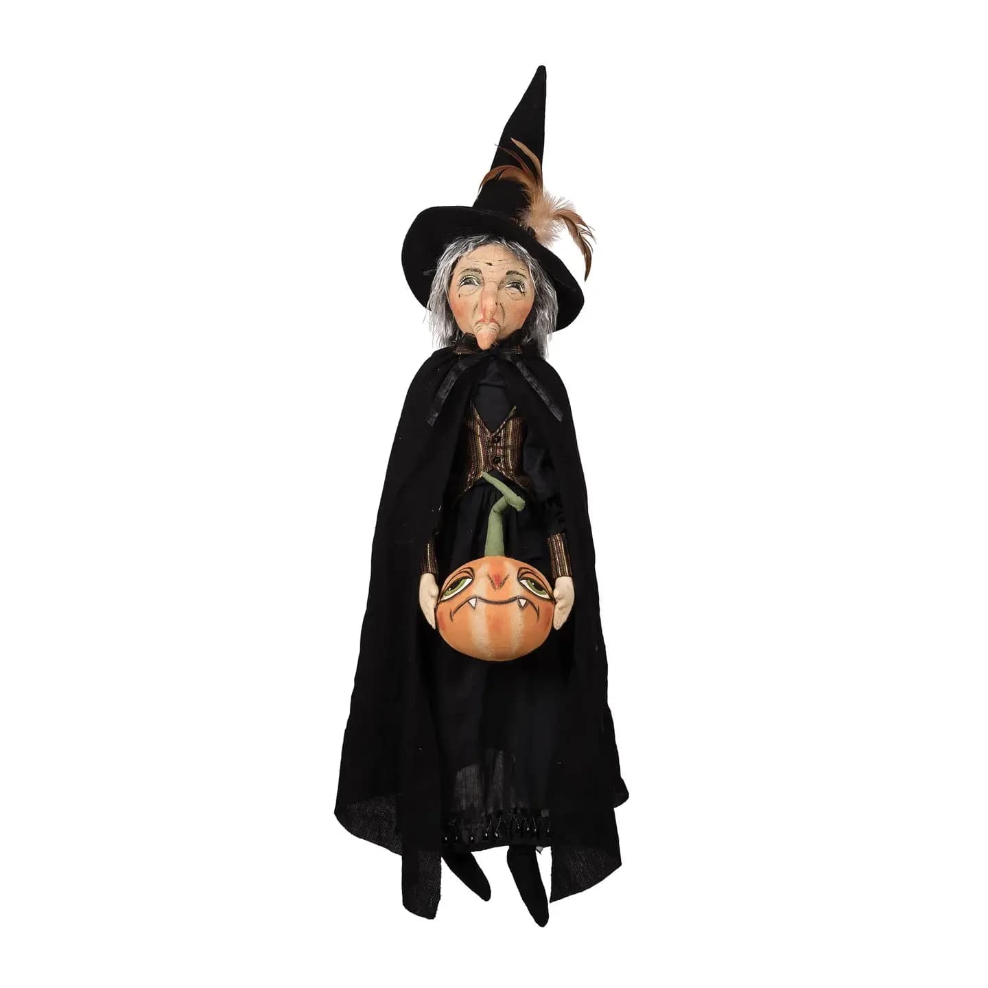Allegra Witch - This charming, large-size doll is the perfect addition to your Halloween decorations. Allegra is dressed in a long black dress with a classic pointy hat, and she’s carrying a sinister looking jack-o'-lantern. Whimsically wonderful and a little bit spooky, this uniquely handcrafted art doll from Joe Spencer's Gathered Traditions collection will bring a touch of fun and scary to your home during the Halloween season.  40&quot; tall