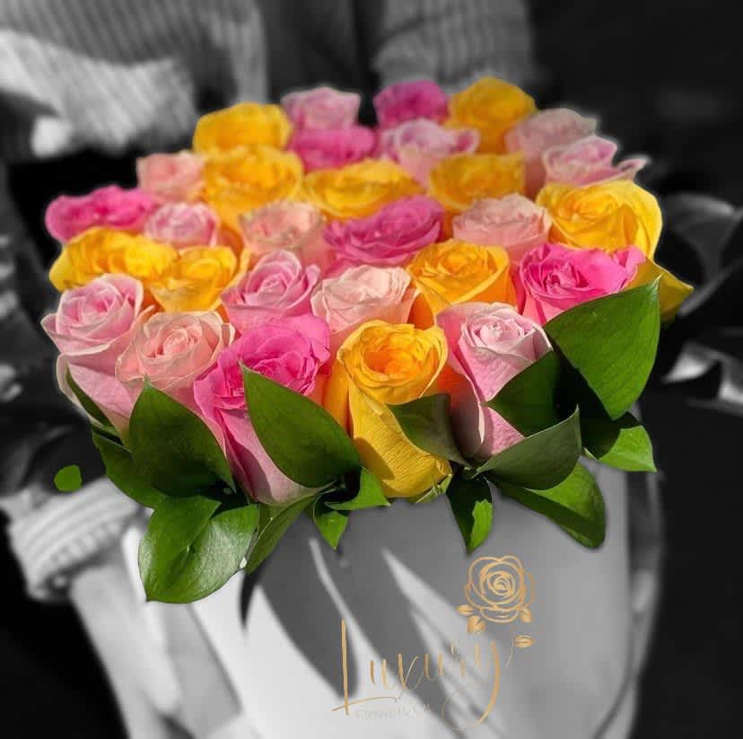 Colorful Box - &quot;PLACE YOUR ORDER AT LEAST 2 DAYS PRIOR TO THE DELIVERY DATE”  Our exclusive designs of colorful fresh flowers are a true symbol of luxury arrangements for all occasions.  Roses in Box: 30-36 stems of natural roses. 6” White or Black Cylinder Container (subject to inventory availability) All Occasion Check our coverage area.  Place your Order Online Monday to Saturday before 1:00 p.m. (E.T.) for same-day delivery.  “Orders received after hours will be delivered the next business day”. Check our coverage area.  Occasionally, substitutions of flowers and/or containers happen due to weather, seasonality, and market conditions which may affect availability. If this is the case with the gift you’ve selected, we will ensure that the style, theme, and color scheme of your arrangement are preserved and will only substitute items of equal value or higher value.  CARE INSTRUCTIONS Gently mist the arrangement with natural water every other day. Do not spray any cleaning product on the flower arrangement. Do not place heavy objects directly on the flower arrangement. Keep them out of direct sunlight and extreme heat. 