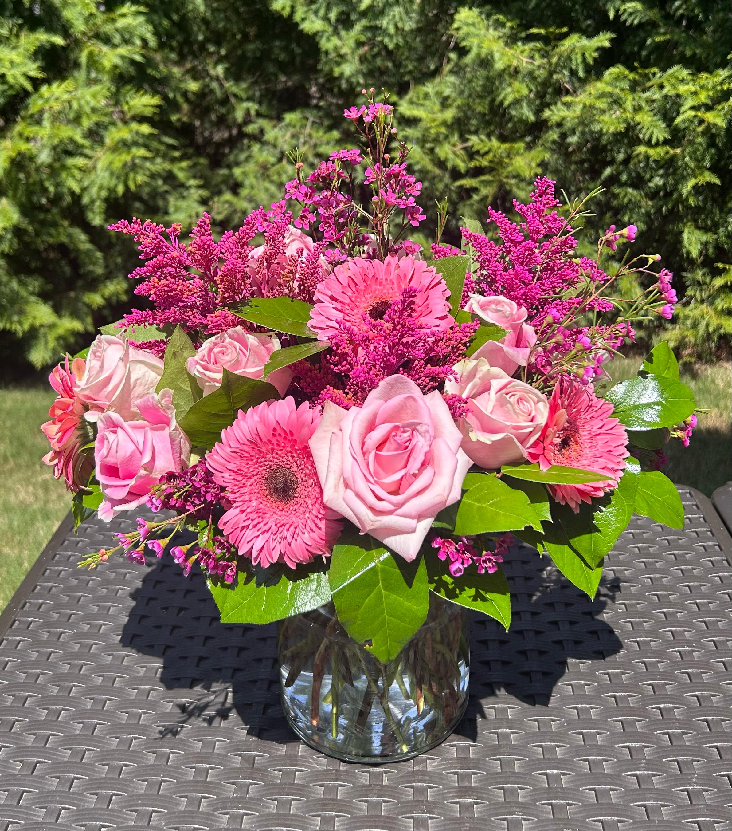 Ella Bouquet - Elegantly crafted with an array of pink and green blooms. Bloom Details: Gerbera Daisies, Roses, Aster , Green Foliage Mix Clear Glass All Occasion  Place your Order Online Monday to Saturday before 1:00 p.m. (E.T.) for same-day delivery. “Orders received after hours will be delivered the next business day”. Check our coverage area.  Occasionally, flowers and/or container substitutions happen due to weather, seasonality, and market conditions, which may affect availability. If this is the case with the gift you’ve selected, we will ensure that your arrangement's style, theme, and color scheme are preserved and will only substitute items of equal value or higher value.  CARE INSTRUCTIONS Keep the flower arrangement hydrated with natural water and change the water every two days. Do not spray any cleaning product on the flower arrangement. Do not place heavy objects directly on the flower arrangement. Keep flower arrangements out of direct sunlight and extreme heat.