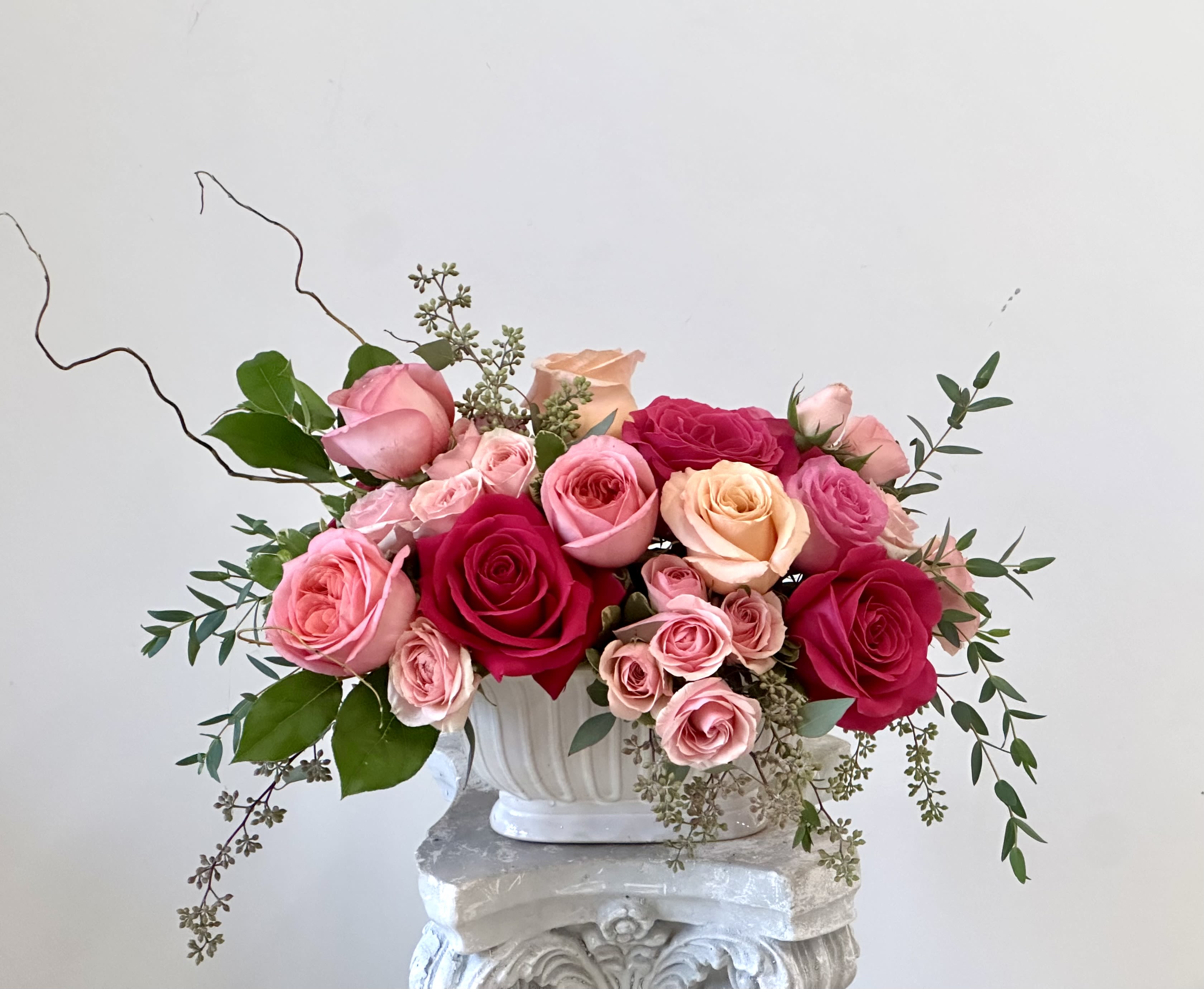 English Garden by Westford Florist Art by Veny - Transform your space into a blooming oasis with the English Garden by Westford Florist Art by Veny! This delightful arrangement features elegant roses and charming spray roses, all nestled among vibrant greenery. Housed in a chic ceramic container, it’s not just a floral display; it’s a statement piece that brings warmth and elegance to any room. Whether you’re treating yourself or surprising someone special, this exquisite bouquet is sure to brighten anyone’s day. Perfect for every occasion or simply as a lovely pick-me-up for your home. Bring the charm of an English garden indoors and let nature's beauty flourish in style! 