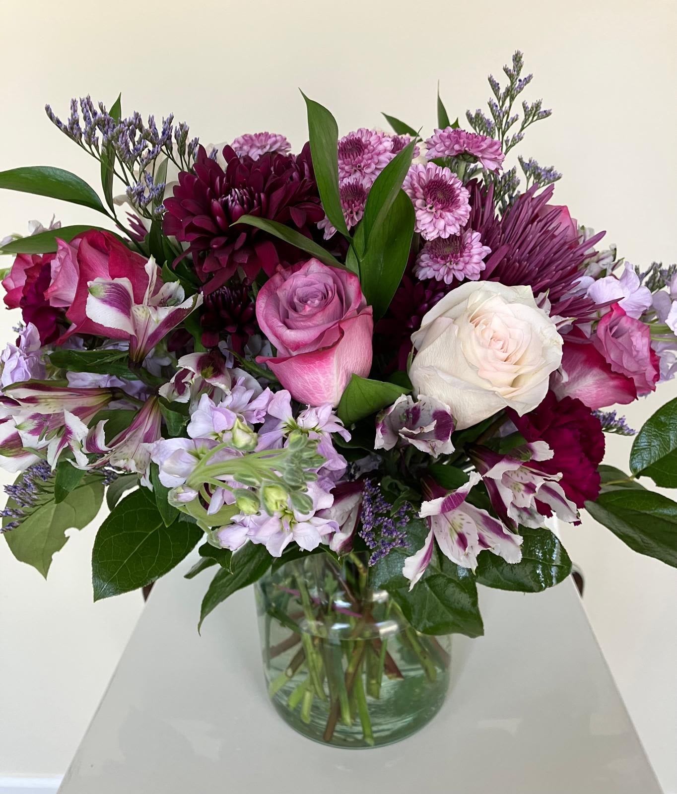 Erika Bouquet - This bouquet isn't just a gift; it's a statement. The mix of roses, dahlia, and alstroemeria creates a perfect blend of romance and elegance. It's ideal for any occasion, or simply to remind someone how special they are. Give a gift that blooms with emotions.   All Occasion Glass Container  • Place your Order Online Monday to Saturday before 1:00 p.m. (E.T.) for same-day delivery. • “Orders received after hours will be delivered the next business day”. • Check our coverage area.  • Occasionally, substitutions of flowers and/or containers happen due to weather, seasonality, and market conditions which may affect availability. If this is the case with the gift you’ve selected, we will ensure that the style, theme, and color scheme of your arrangement are preserved and will only substitute items of equal value or higher value.  CARE INSTRUCTIONS Keep the flower arrangement hydrated with natural water and change the water every two days. Do not spray any cleaning product on the flower arrangement. Do not place heavy objects directly on the flower arrangement. Keep flower arrangements out of direct sunlight and extreme heat.