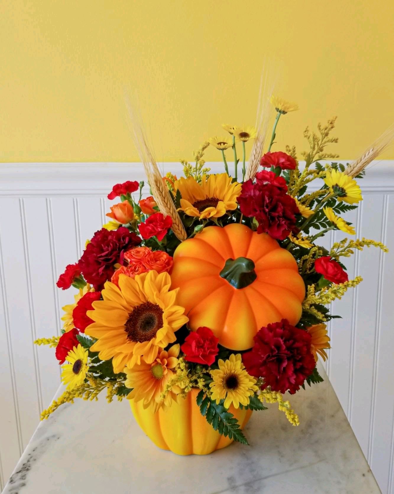 Pumpkin Spice - Seasonal brilliant fall blooms designed in an orange pumpkin shaped ceramic reusable vase.
