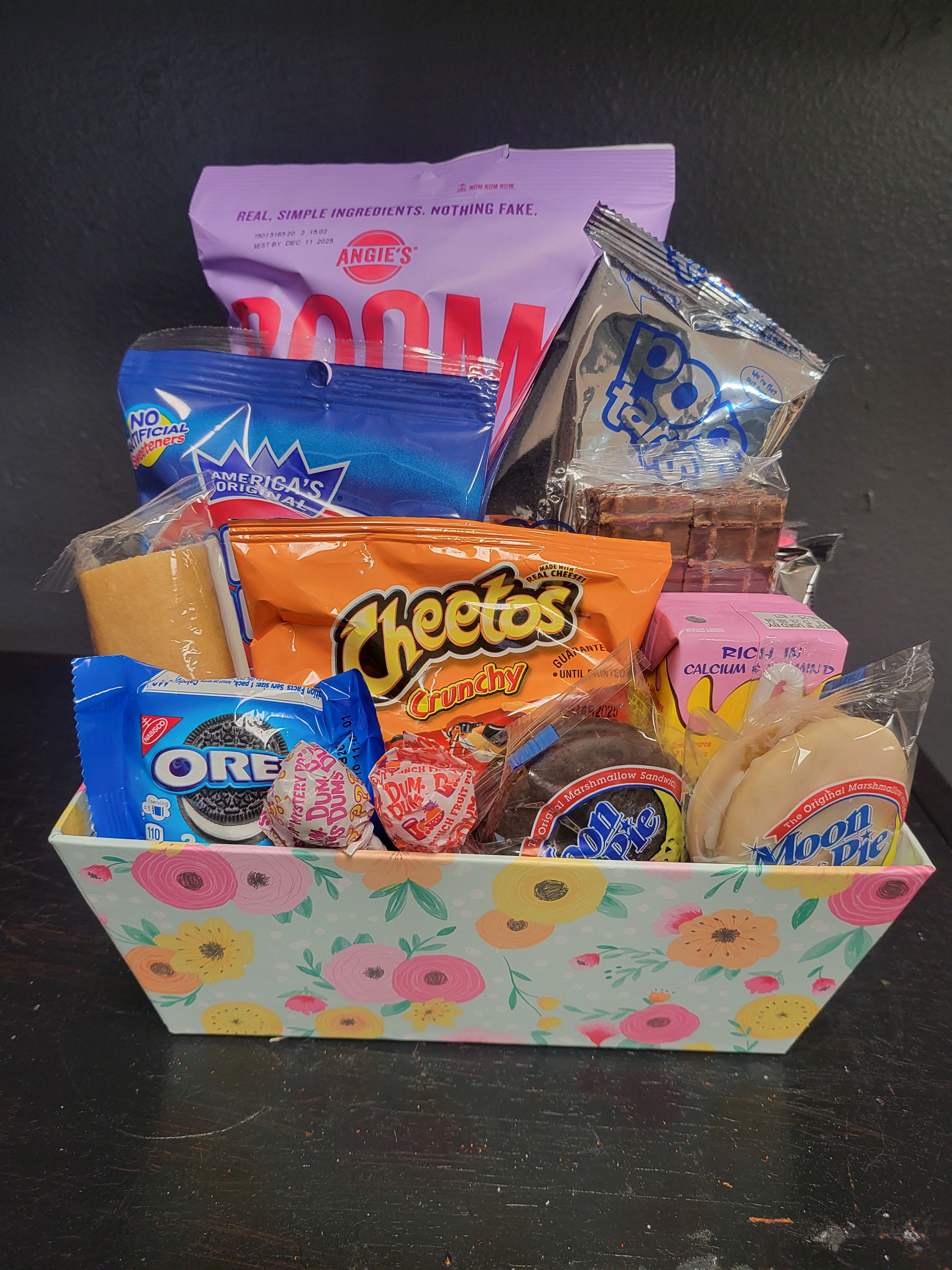 The Poppy Goodie Basket by Katherine's Flowers The Poppy Goodie Basket by Katherine's Flowers - A fun mixed snacks and candy bouquet filled with a variety snacks & candy that would be sure to brighten up any occasion. The perfect gift for birthdays or just that you're thinking about your special friend