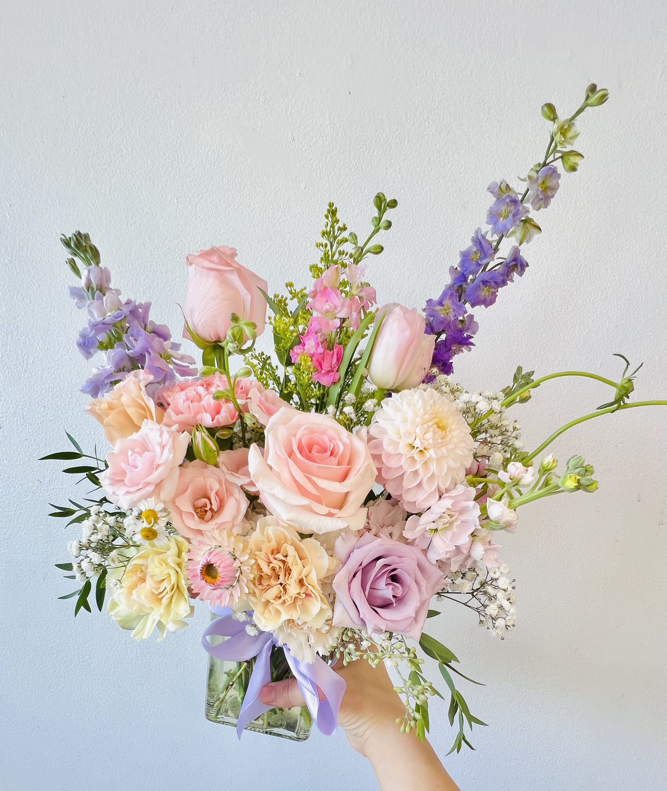 Joy Blooms (M) - *Medium Clear Vase Arrangement :   *Store Hours: Mon~ Fri: 10:00 a.m. to 6:00 p.m. Sat: 9:00 a.m. to 4:00 p.m. Sun: Closed  *Delivery:  Deliveries occur roughly between 9am - 5pm. We are unable to offer further specific delivery windows or guarantee delivery times. but we will always do our best to accommodate requests. If your delivery address has a gate code number, please provide it for smooth delivery. Thank You :)  *PICK UP:  We work with a limited staff. We can only take a limited amount of orders per day. Please try to time your pickup as close to the shop as possible to avoid congestion and ensure the freshness of your flowers. Sometime we may not be in the shop due to flower deliveries or event flowers set-up.  If you need to pick up before 10am, please contact our shop to place your order directly. Text order: (714)715-1482  *Please note that your arrangement may vary slightly from the picture depending on the season and store stock, but we will match color schemes and guarantee it will be fresh &amp; beautiful.  Thank you! 