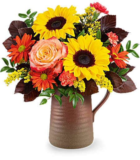 Sunburst Harmony Bouquet - Featuring cheerful sunflowers, rich warm fall tones, this stunning seasonal bouquet sits in a rustic stoneware pitcher! Approximately 13 inches wide and 13 1/2 inches tall for the Standard size.
