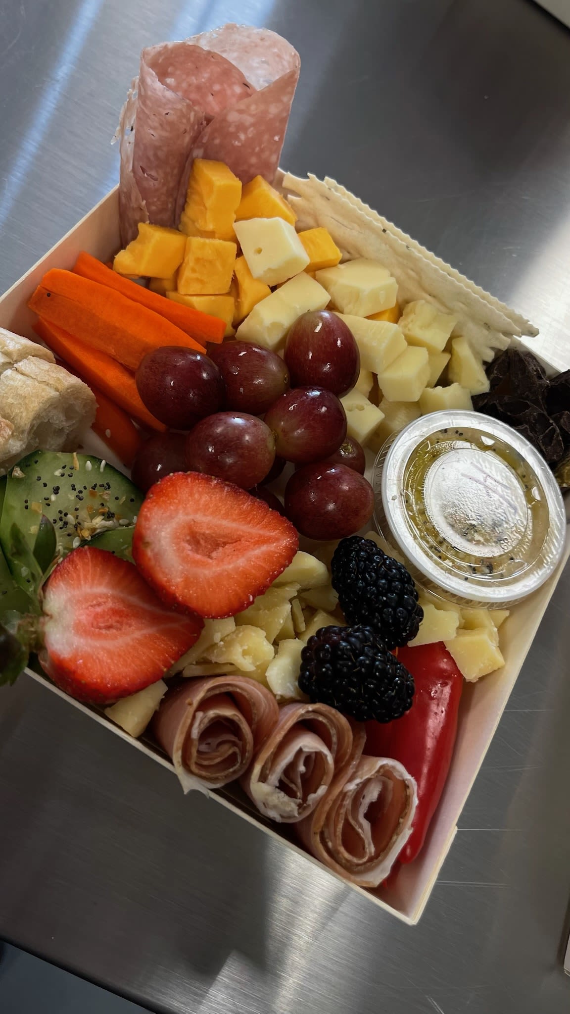 Small Charcuterie Box - A gift bursting with a variety of cured meats, cheeses and colorful fruits and vegetables, with a touch of something sweet. Perfect for any casual affair!  