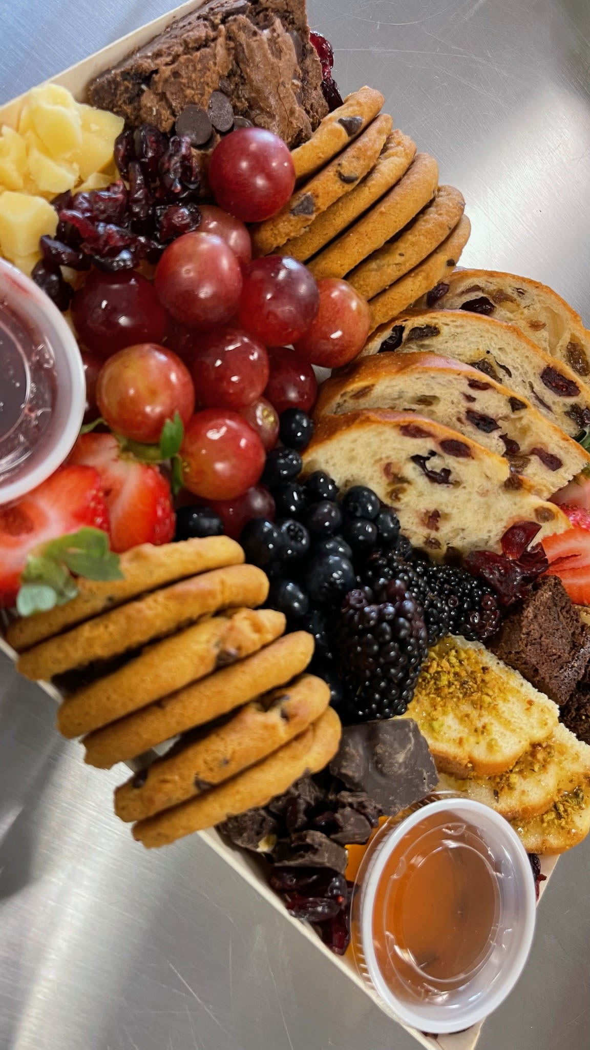 Large Charcuterie Box - Beautifully arranged, artfully curated grazing experience featuring a generous assortment of gourmet meats, artisanal cheeses, and a variety of sweet and savory accompaniments. 