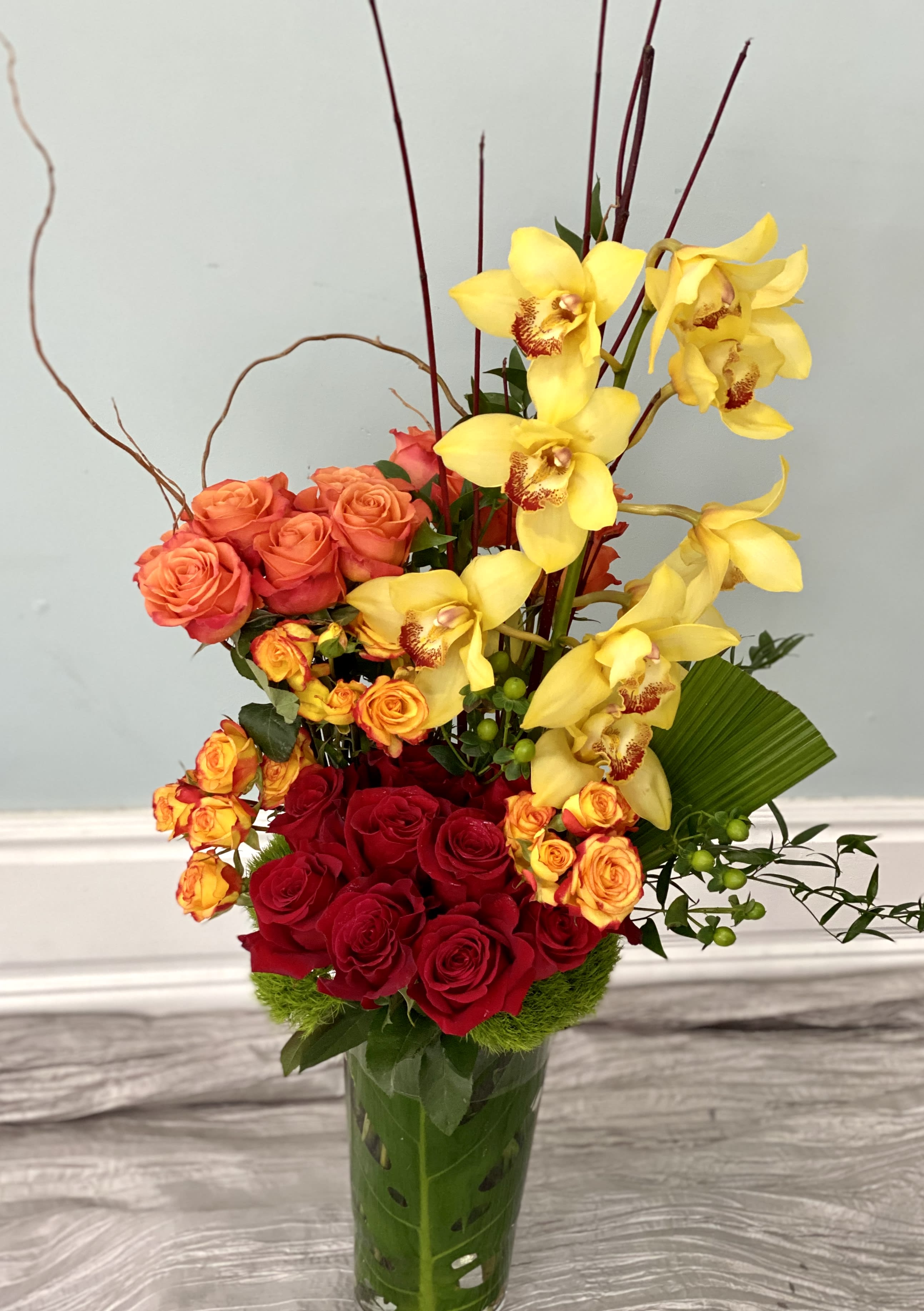 The Grandeur - Give the splendidness and impressiveness of this arrangement to that special someone whos outstanding achievement needs recognition or who has won your heart! No matter what the life event is, this arrangement will truly create the right effect! At check out make your colour requests from soft pastels, to strong intensities or monochromatic.  Your personalized card is always handwritten and always free with Art Le Fleur!