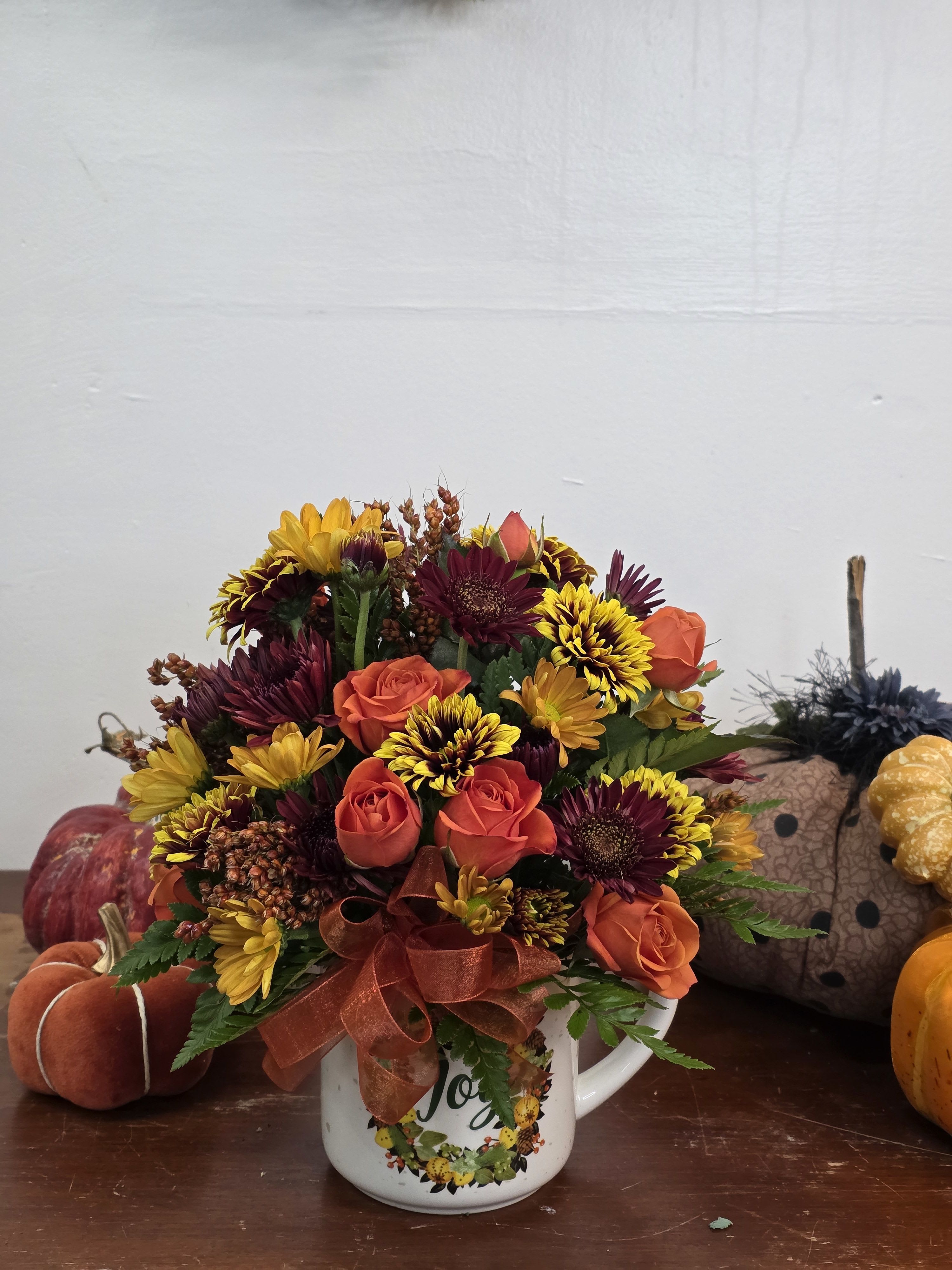 Autumn Magic Mug - A keep sake mug the easily transitions from autumn to winter reminding them you care and think of them all seasons. Filled with seasons mums, spray roses and texture. This is a fan favorite.