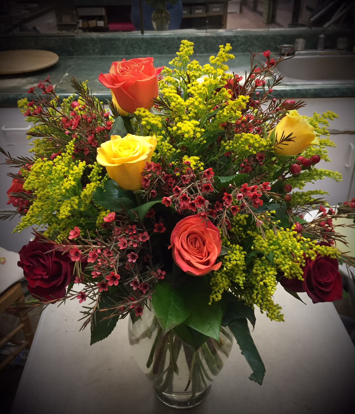 Fall Roses - Vase of roses in the colors of fall. Can be one, two, three or even four colors  with bright accents to match. Color selection varies daily Standard size is 12 roses.