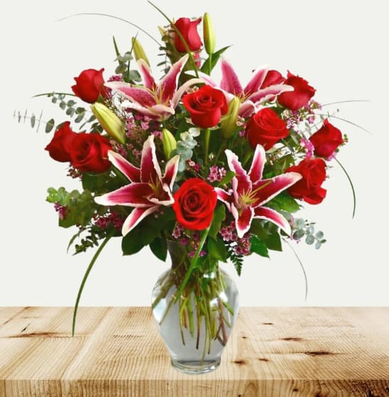 Hollywood Dozen Hollywood Dozen - Wow your special someone with this beautiful mix of red roses and stargazer lilies. This arrangement is perfect for Anniversaries, Valentine's day or Just because.