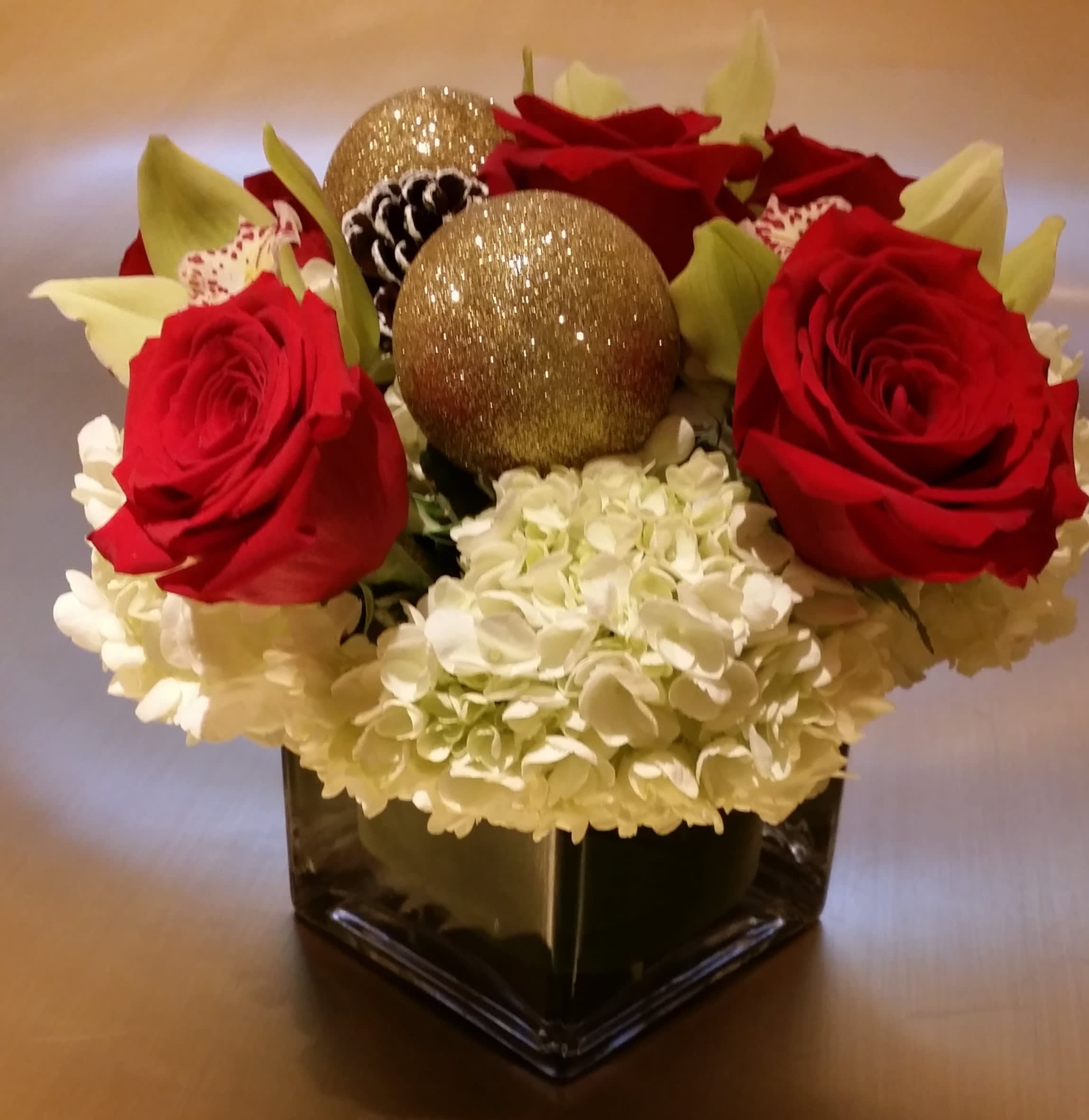 Jolly Christmas  - White Hydrangea, Red Roses &amp; Green Orchids with Christmas Decorations. 