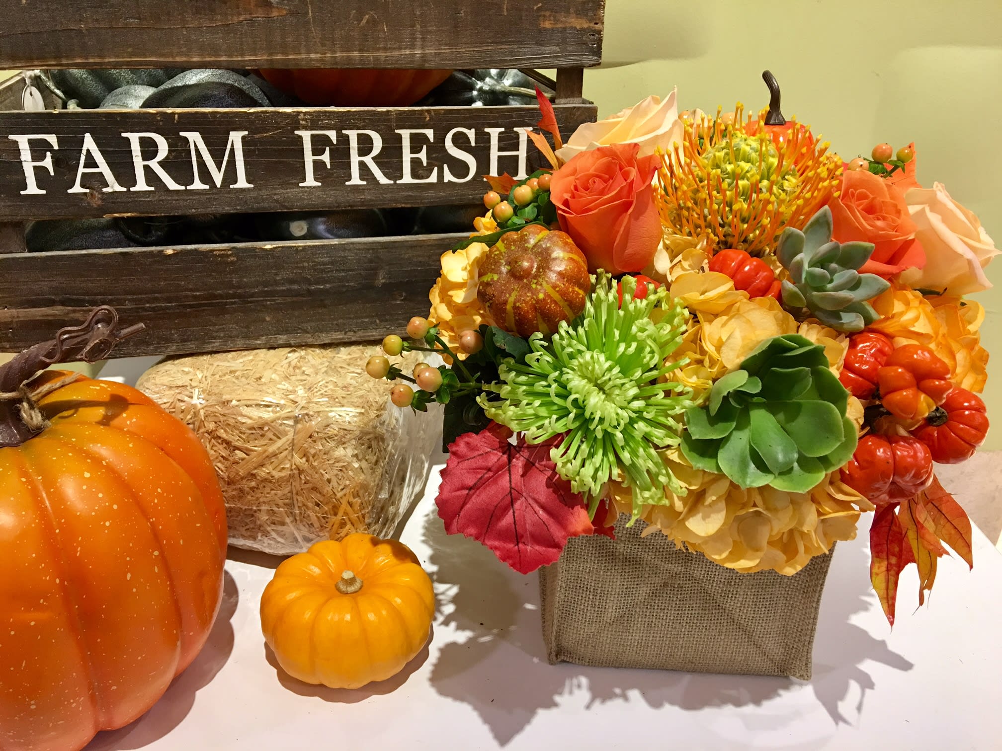 Pumpkin Patch  - collection of flowers and goods in a custom made vase ,makes a great design with lilies  orchid  roses green  mums  hydrangeas and succulents (seasonal)