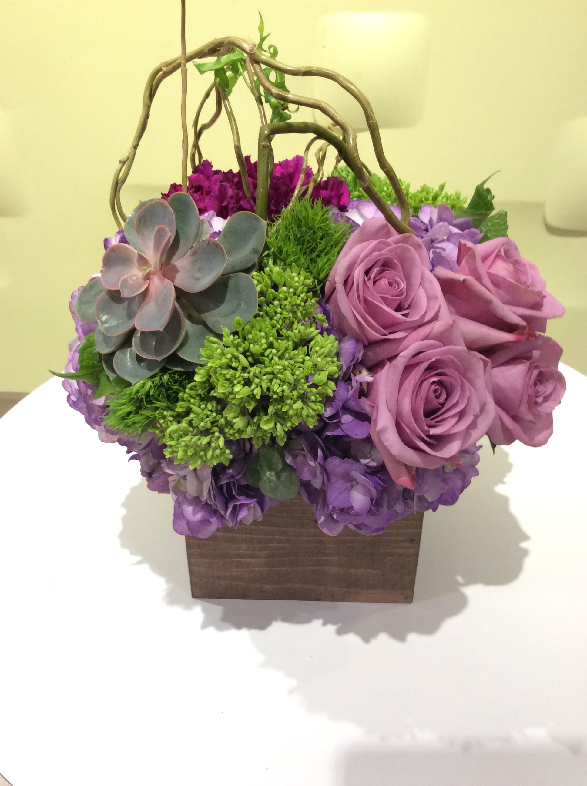 Willows of Summer  - Curly willow never looked so good as it does in this arrangement with stunning succulents, hydrangeas and beautiful lavender roses. It all comes together in a natural, rustic wood box. 