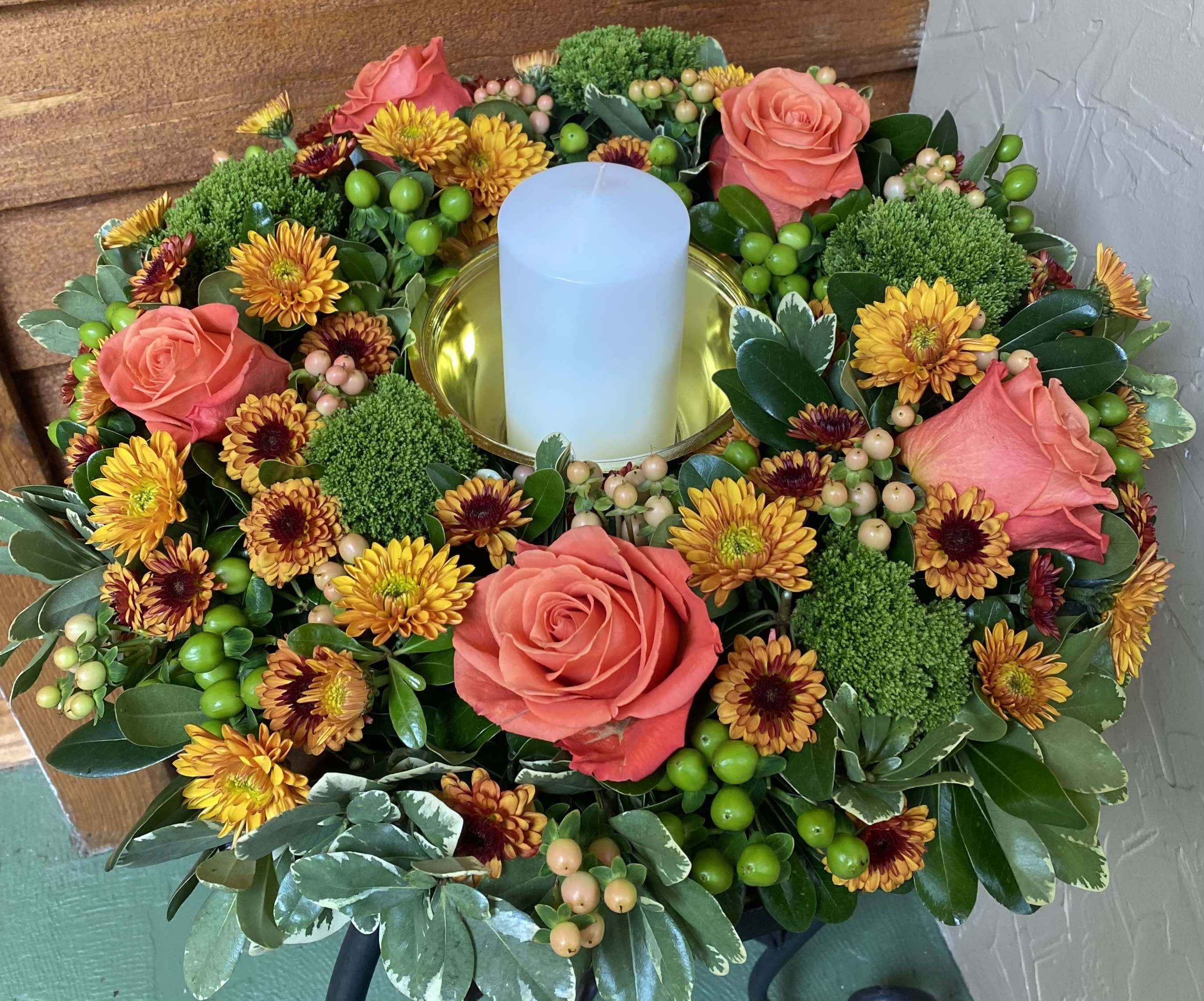 Thanksgiving Centerpiec Thanksgiving Centerpiec - Our signature Wildrose wreath including candle to brighten your Thanksgiving Table~always designers choice on exact flowers selected.