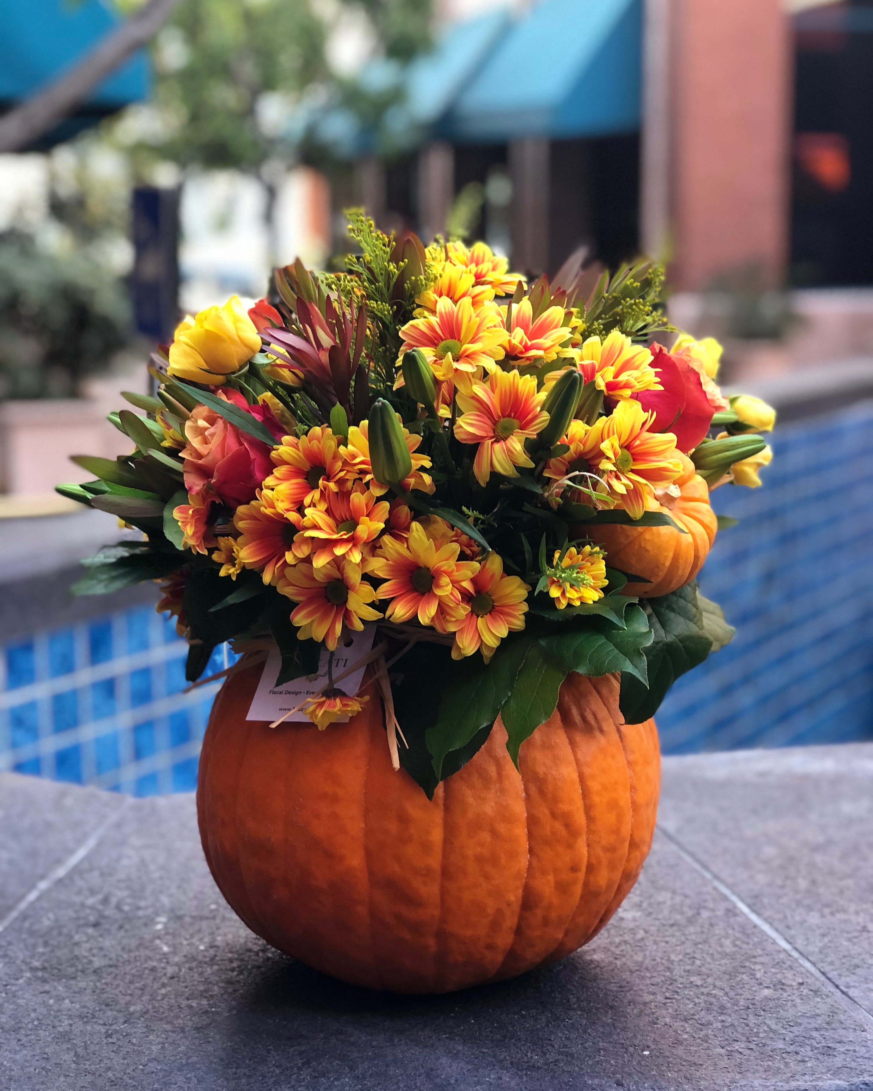pumpkin flowers by laazati - Flowers in yellows, peaches and shades of orange arranged in the pumpkin