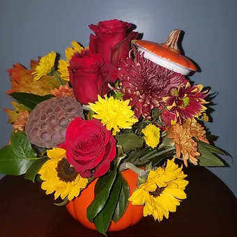 Shiny little pumpkin - Keepsake ceramic pumpkin with lid, beautiful, jewel tone flowers, stuffed to the brim.  Just lovely! one of my favs.