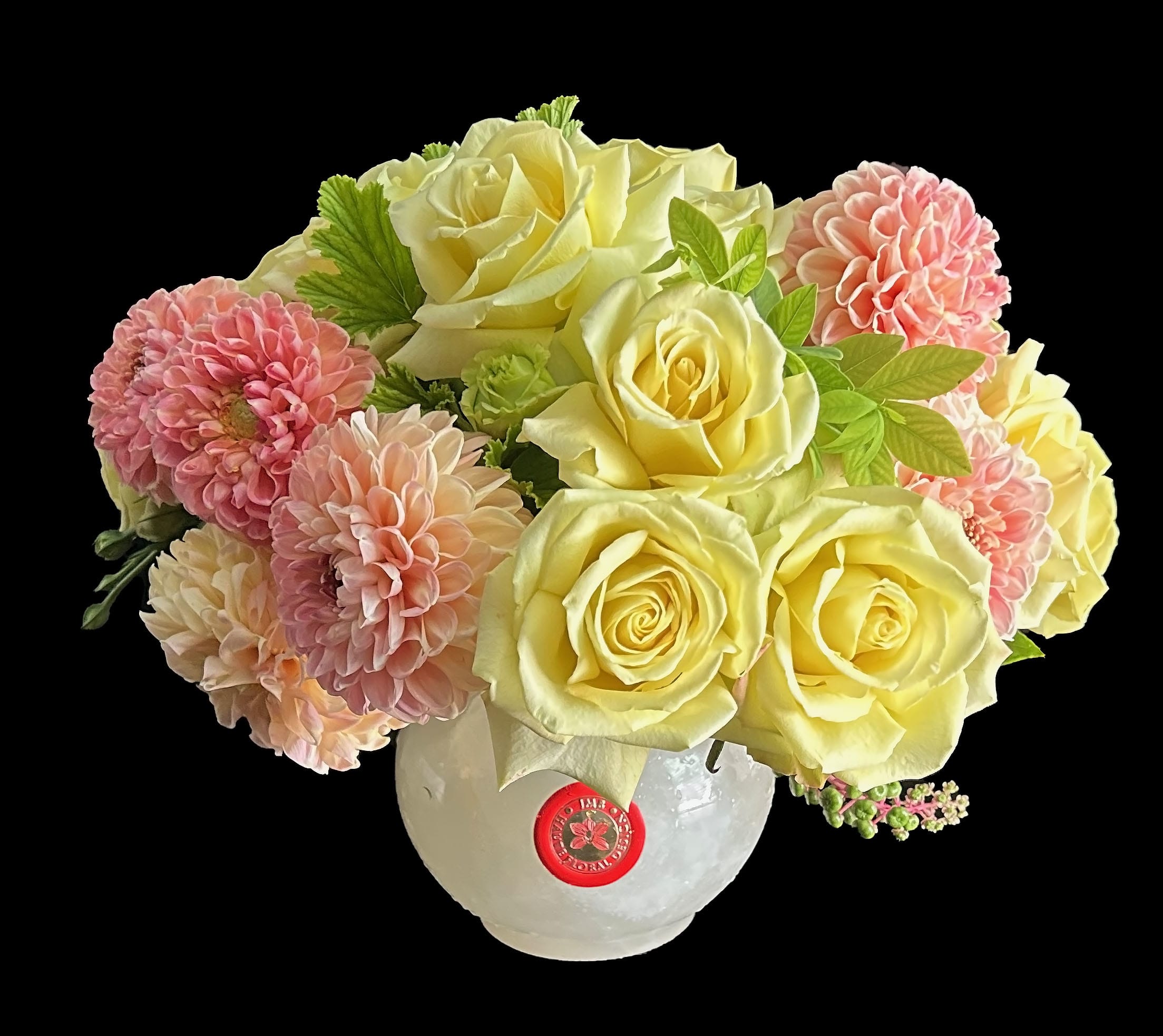 Bubble - Round gorgeous arrangement perfect for a centerpiece available in two different color palettes White onyx vase with yellow and pink blooms or black marble vase with fall toned blooms.