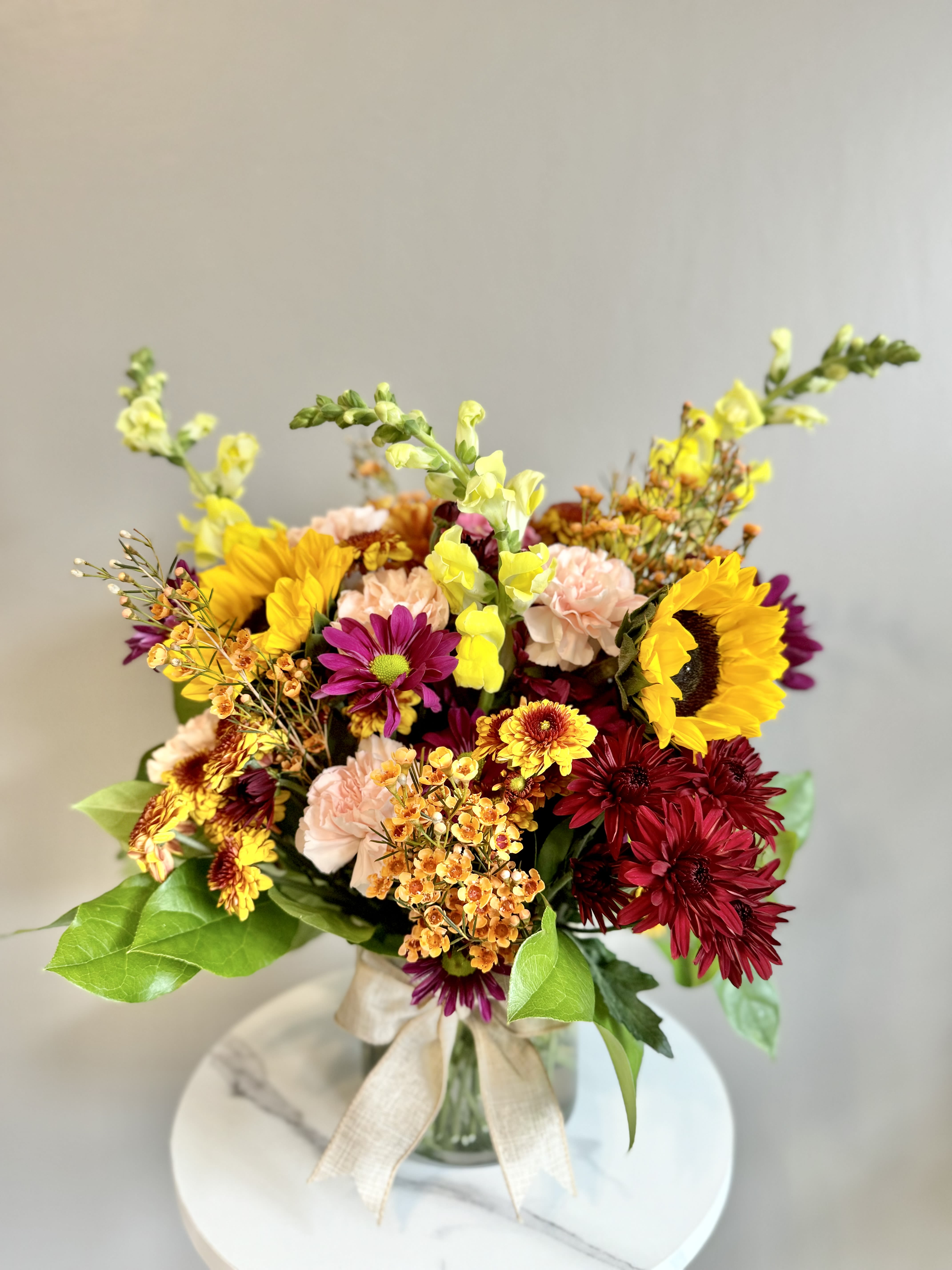 Florist's Pick - A one-of-a-kind arrangement designed with the freshest seasonal blooms, thoughtfully crafted to bring beauty and joy to the recipient. Whether for a special occasion or just because, each Florist’s Pick is made with care and creativity, ensuring a stunning floral surprise every time.  SAME-DAY delivery is available — please allow about three hours from the time your order is placed. 
