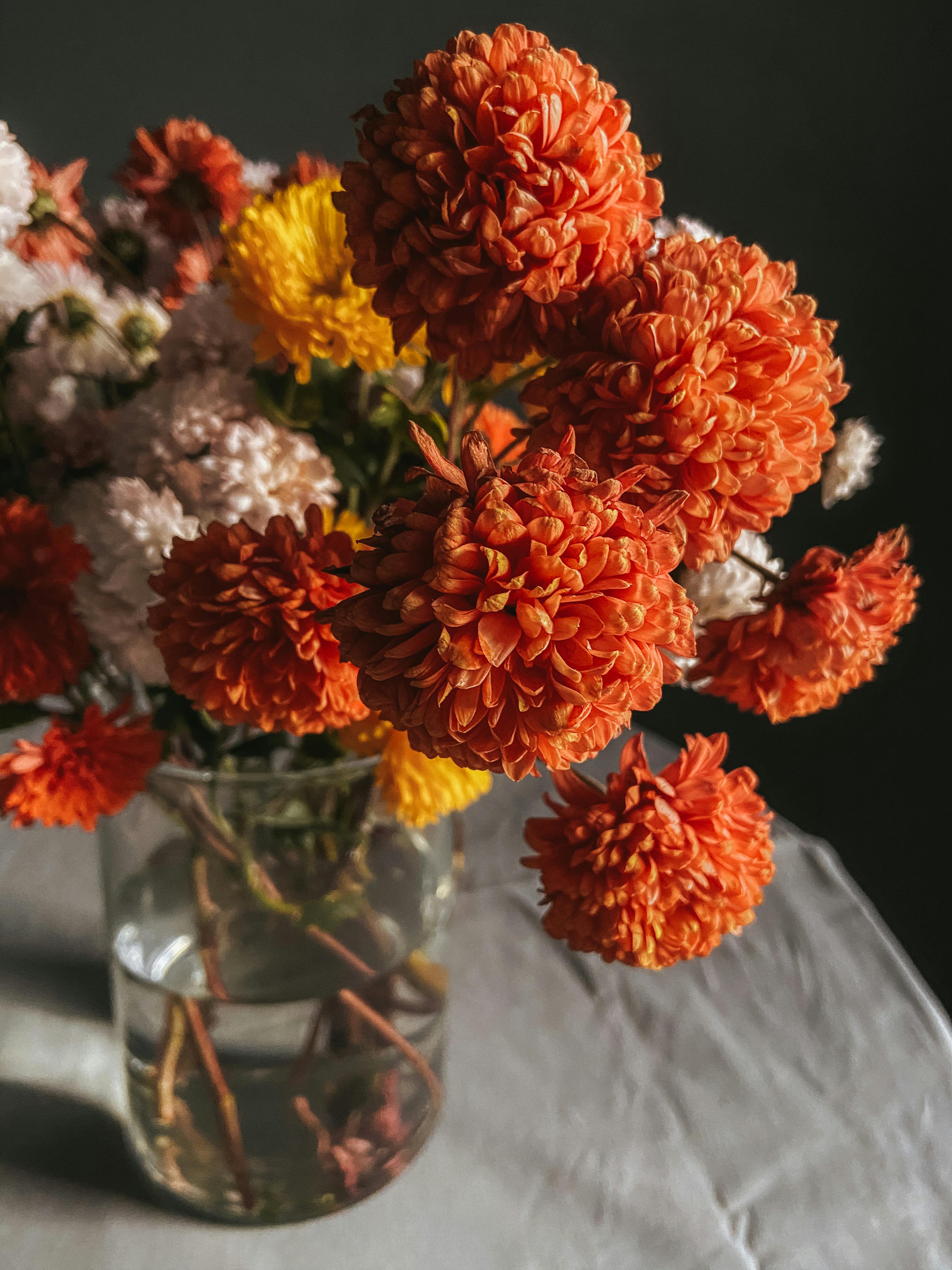 Saffron Dawn - Burnt orange, peach, white, and golden blooms meet in a radiant autumn bouquet, echoing the glow of fall’s first light.