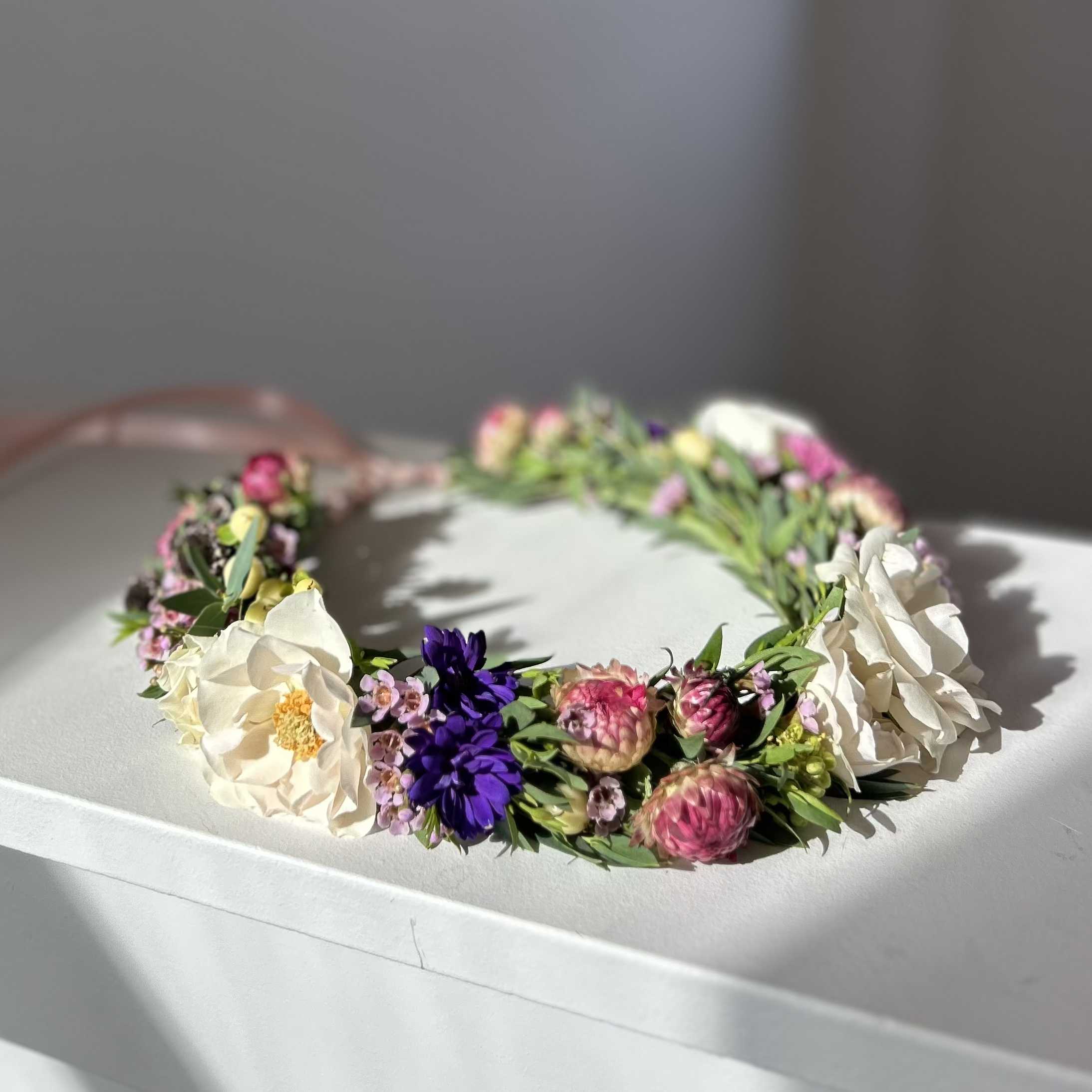 Flower Crown - Softly romantic and full of whimsy, this flower crown is a wearable work of art. Lush blooms in creamy whites, blush tones, and gentle greens are woven together to create a crown that feels both timeless and ethereal. Perfect for brides, bridesmaids, birthdays, maternity shoots, festivals, or anyone wanting to embrace a touch of floral magic.  Each crown is handmade to order and can be customized to match your color palette, ensuring a one-of-a-kind piece designed just for you.