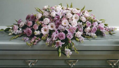 SF53-11 Casket Spray SF53-11 Casket Spray - A casket spray arranged with soft pink blooms and fresh mixed greenery.