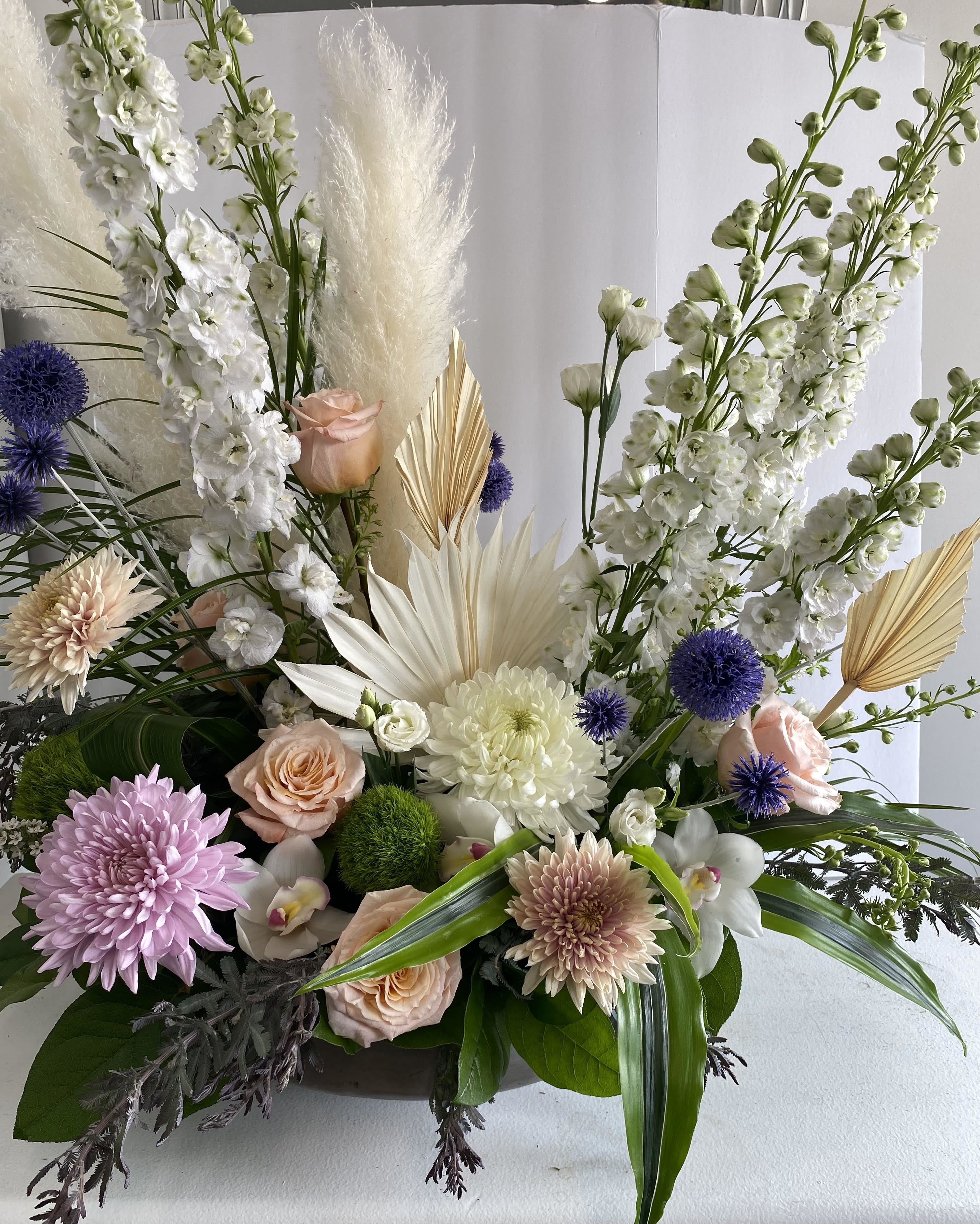 Designer's Choice Vase Arrangement Designer's Choice Vase Arrangement - Let our floral designer create something truly special with the freshest seasonal blooms, artfully arranged in a stylish vase. Each Designer’s Choice arrangement is one-of-a-kind—thoughtfully crafted to showcase the beauty of the season and the natural elegance of every stem.