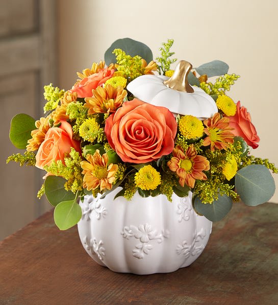 White Pumpkin White Pumpkin - Ceramic White Pumpkin with fall color flowers.