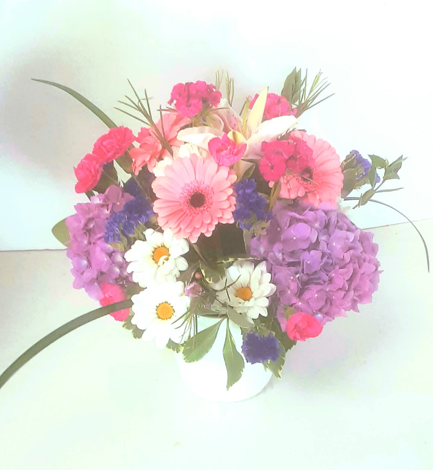 Designers Bouquet Starting at $60 (Deluxe design shown) Designers Bouquet Starting at $60 (Deluxe design shown) - A beautiful mix of colorful flowers in a .round design with a flair. Some flowers will vary