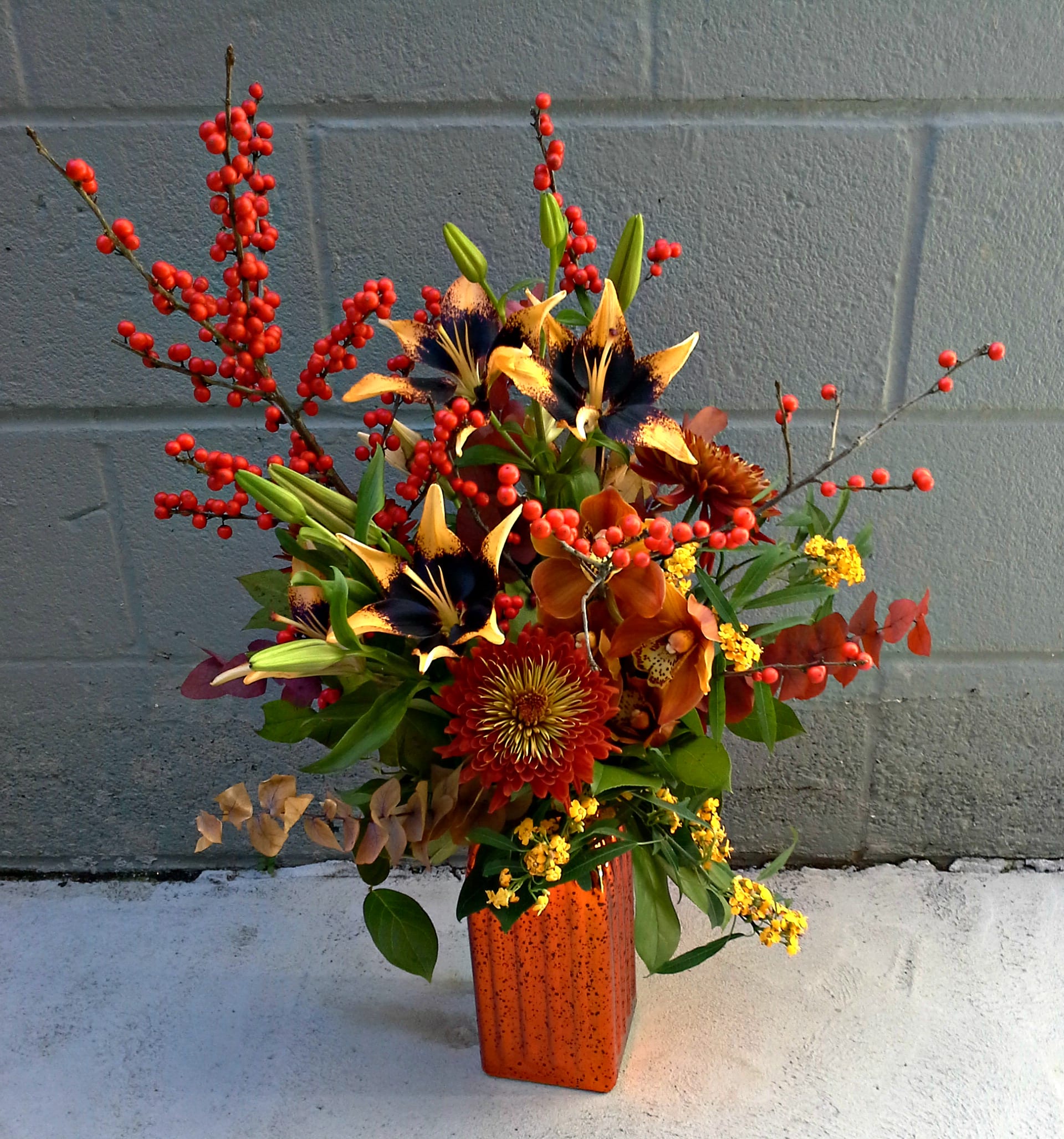 Wonder-Fall - Berries, Chrysanthemums, Lilies and more in a beautiful mercury glass vase.  Best seasonal flowers available and may vary to availabilty.