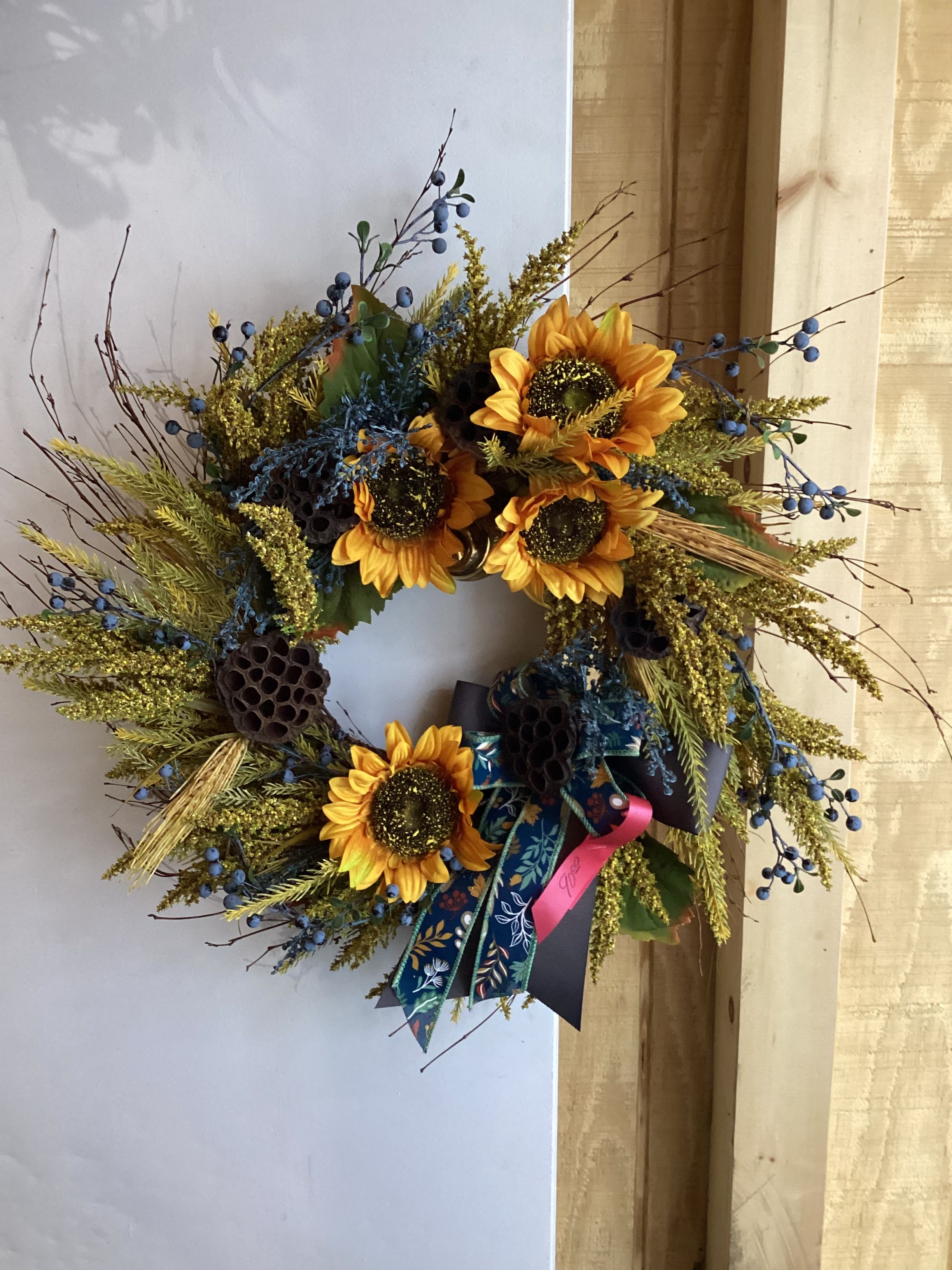 Blue Sunflower Autumn Wreath  - A medium sized wreath with sunflowers and blue ribbon 