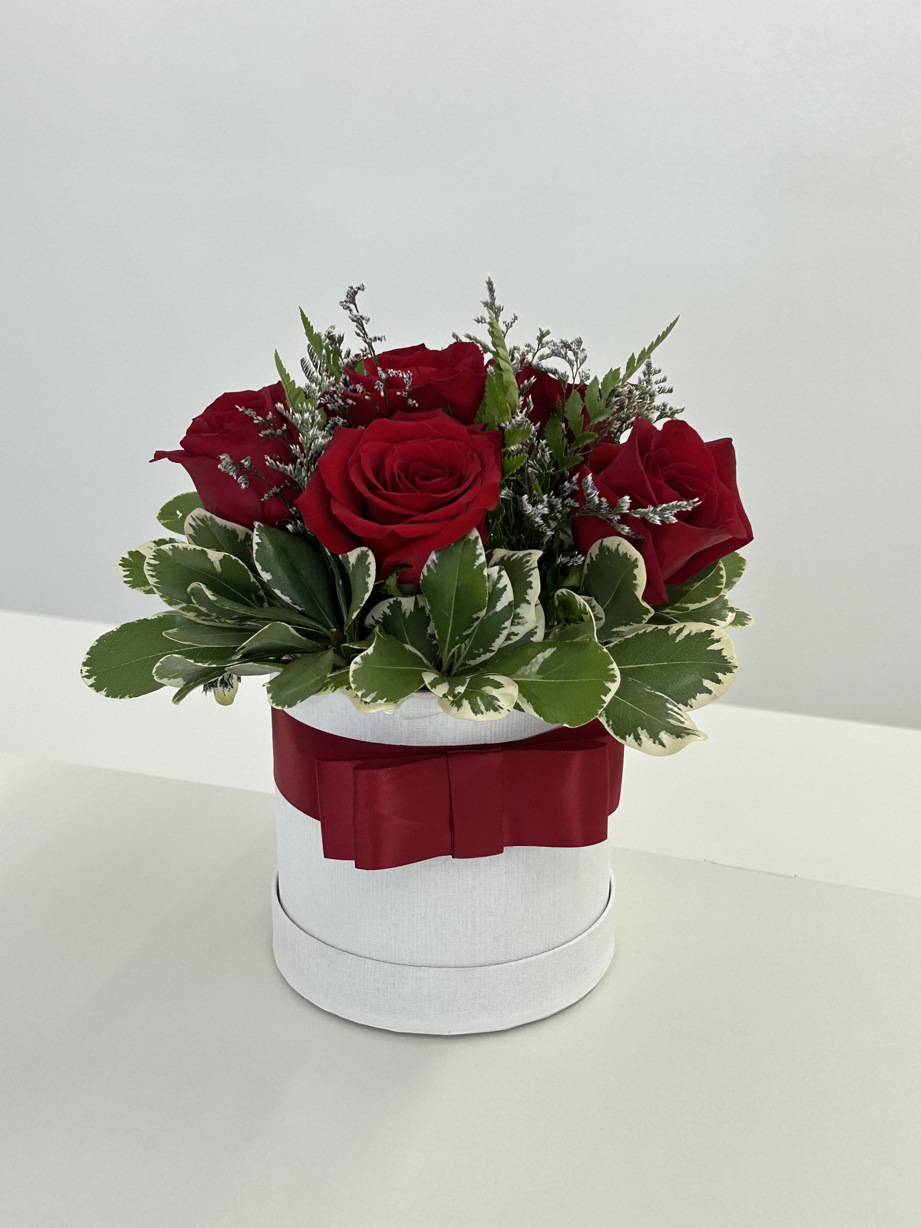 Eternal Flames - Red Roses that represent a love or bond that burns endlessly. (If some flowers and/or the vase are not available there will be minor substitutions.)