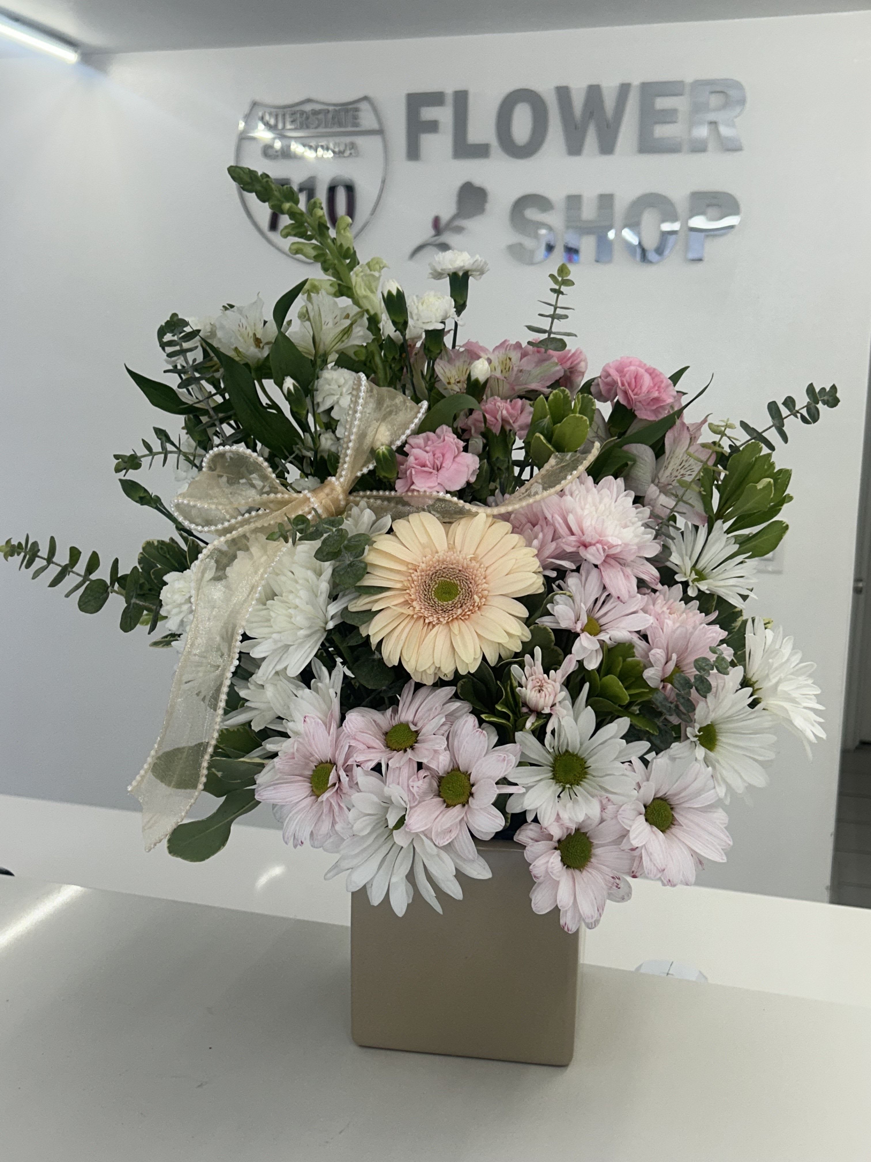 Soft Pink Delight - A mix of soft pink and white daisies, A arrangement that brings a fresh and cheerful feel, perfect for any occation! (If some flowers and/or the vase are not available there will be minor substitutions.)