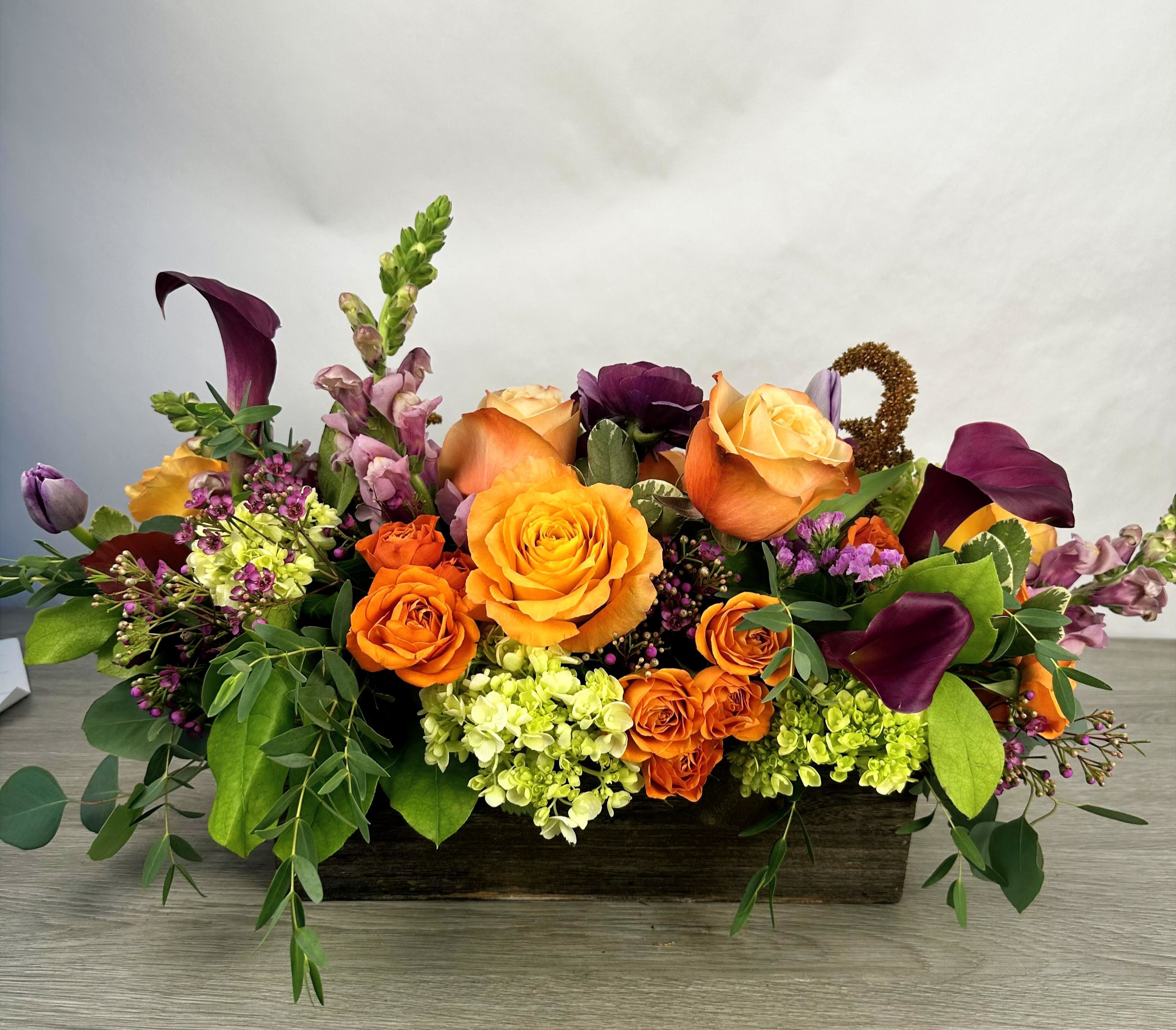 Rustic Harvest  - Bring the rich beauty of autumn indoors with this stunning fall floral arrangement. Featuring a warm palette of golden yellows, deep burgundy, burnt orange, and soft cream, this bouquet captures the essence of the season.