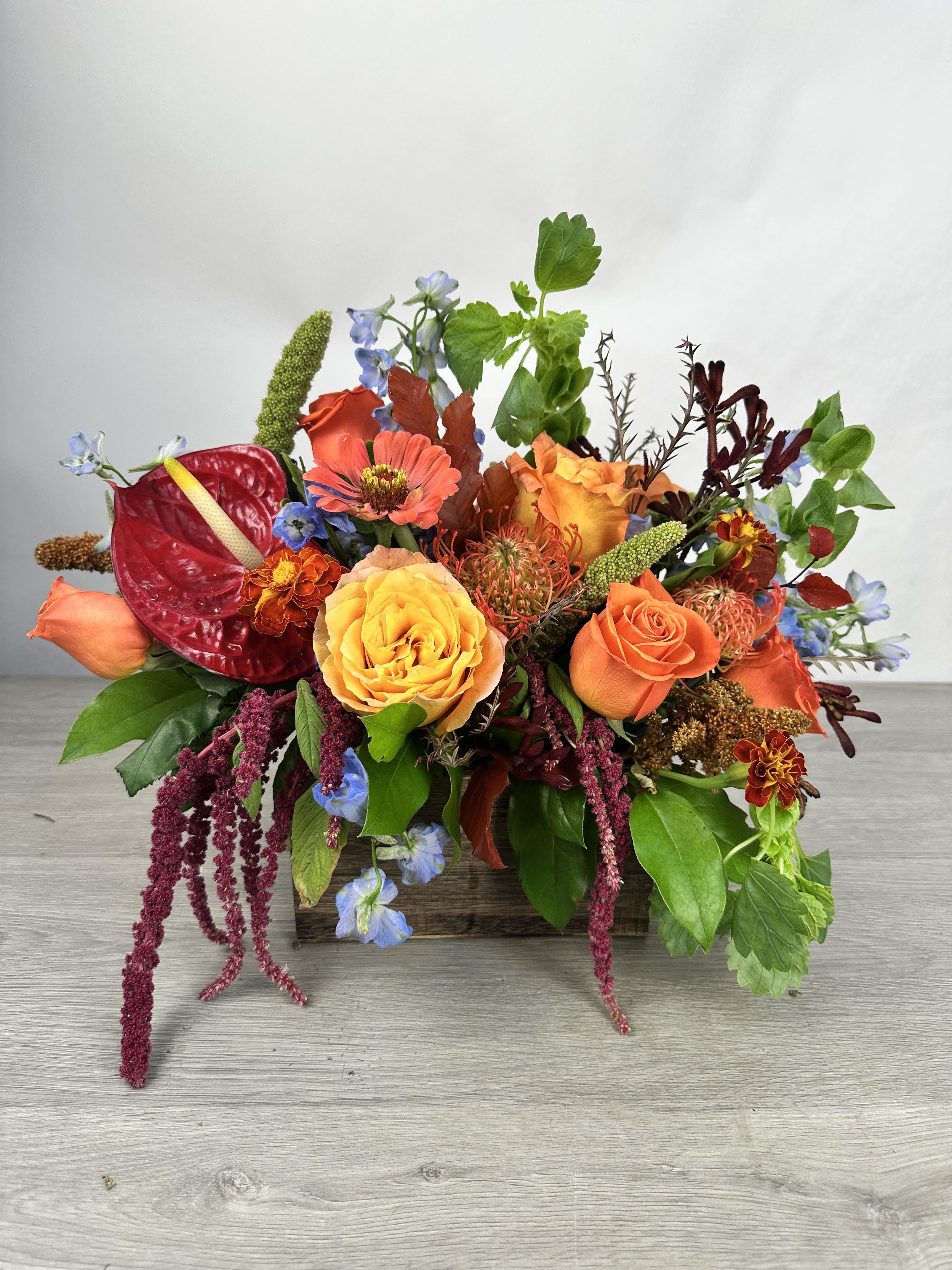 Maple Muse  - Celebrate the beauty of the season with this rich and radiant fall floral arrangement. Bursting with the warm tones of autumn!
