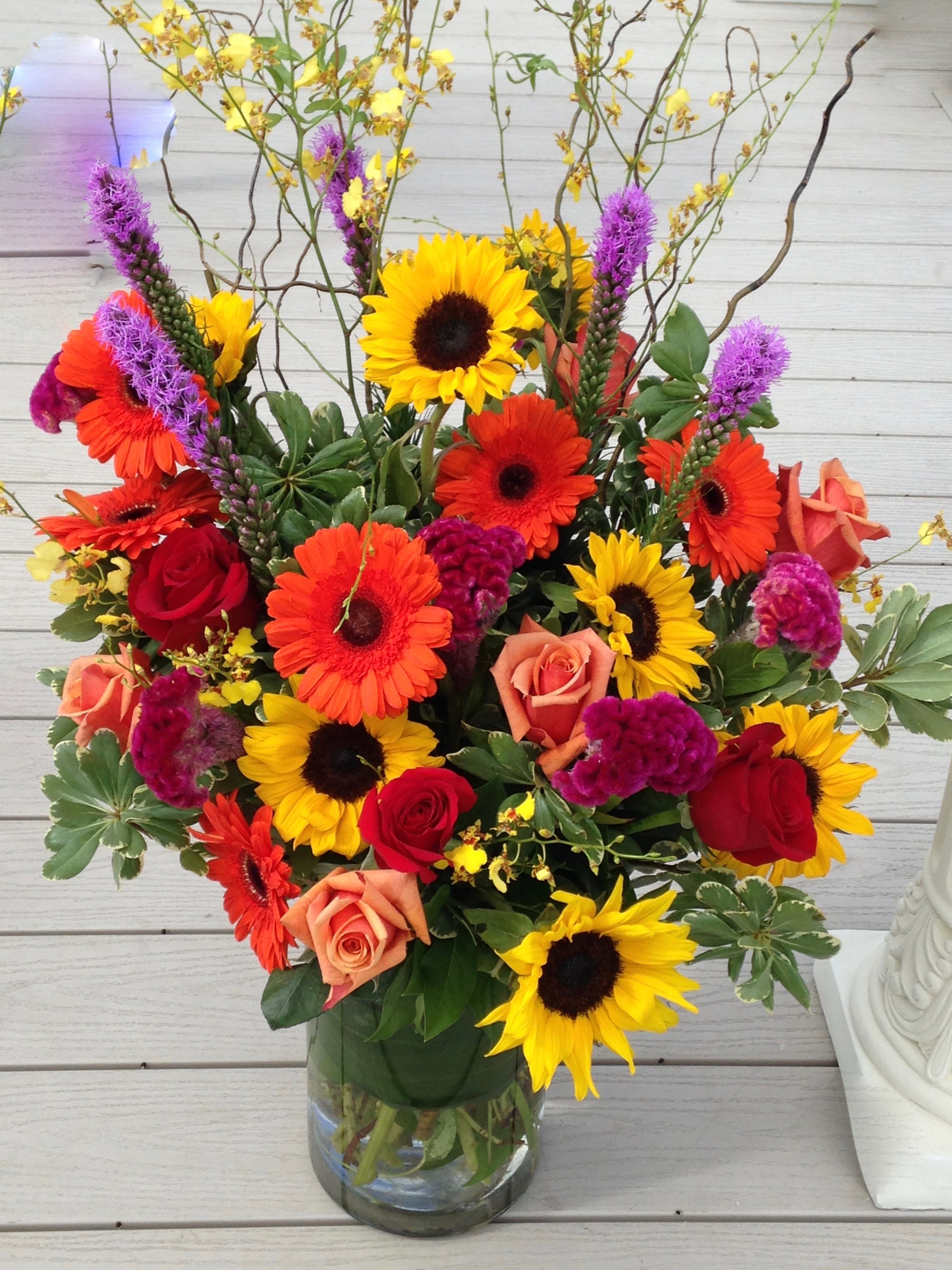 Autumn breeze - Beautiful assortment of bright,  colorful fall blooms arranged artfully for you. 