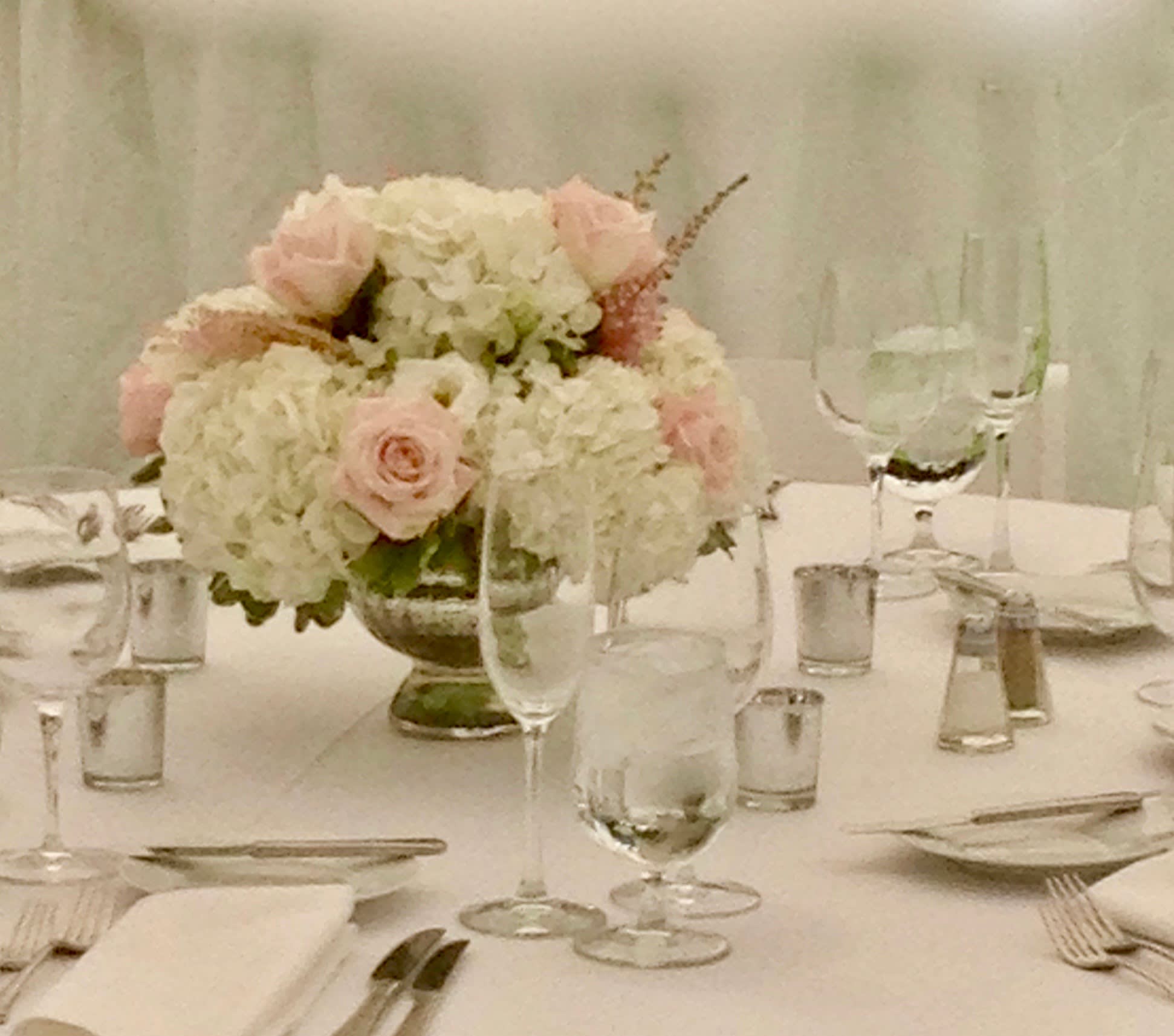The Fairmont The Fairmont - Glass Vase filled with white hydrangea and blush roses, sure to set the state for a romantic dinner, or a Holiday Centerpiece,