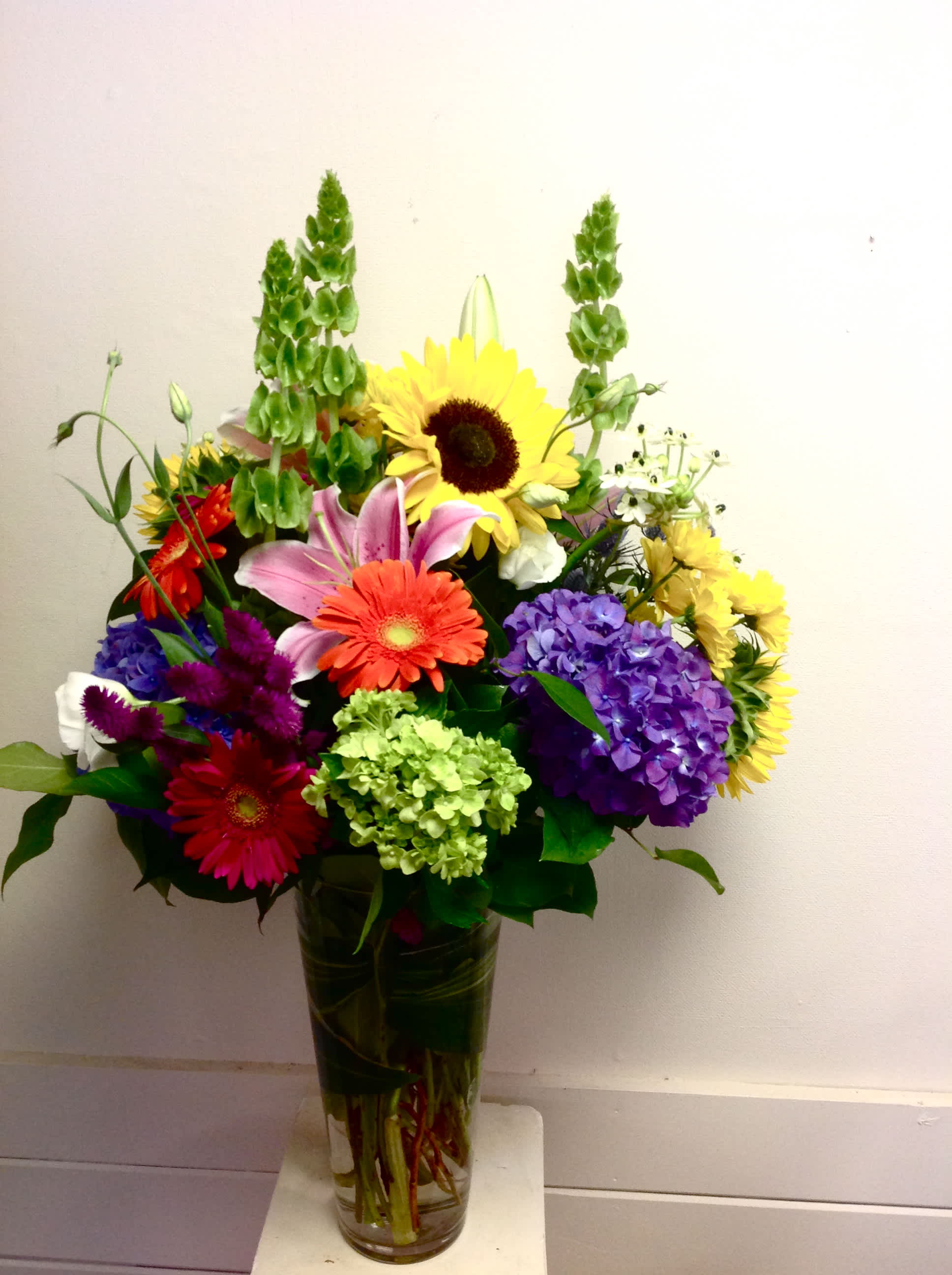 Harvest Moon Harvest Moon - Vase of bells of ireland, oriental lilys, gerbera daisies, hydrangeas, lisianthus and more