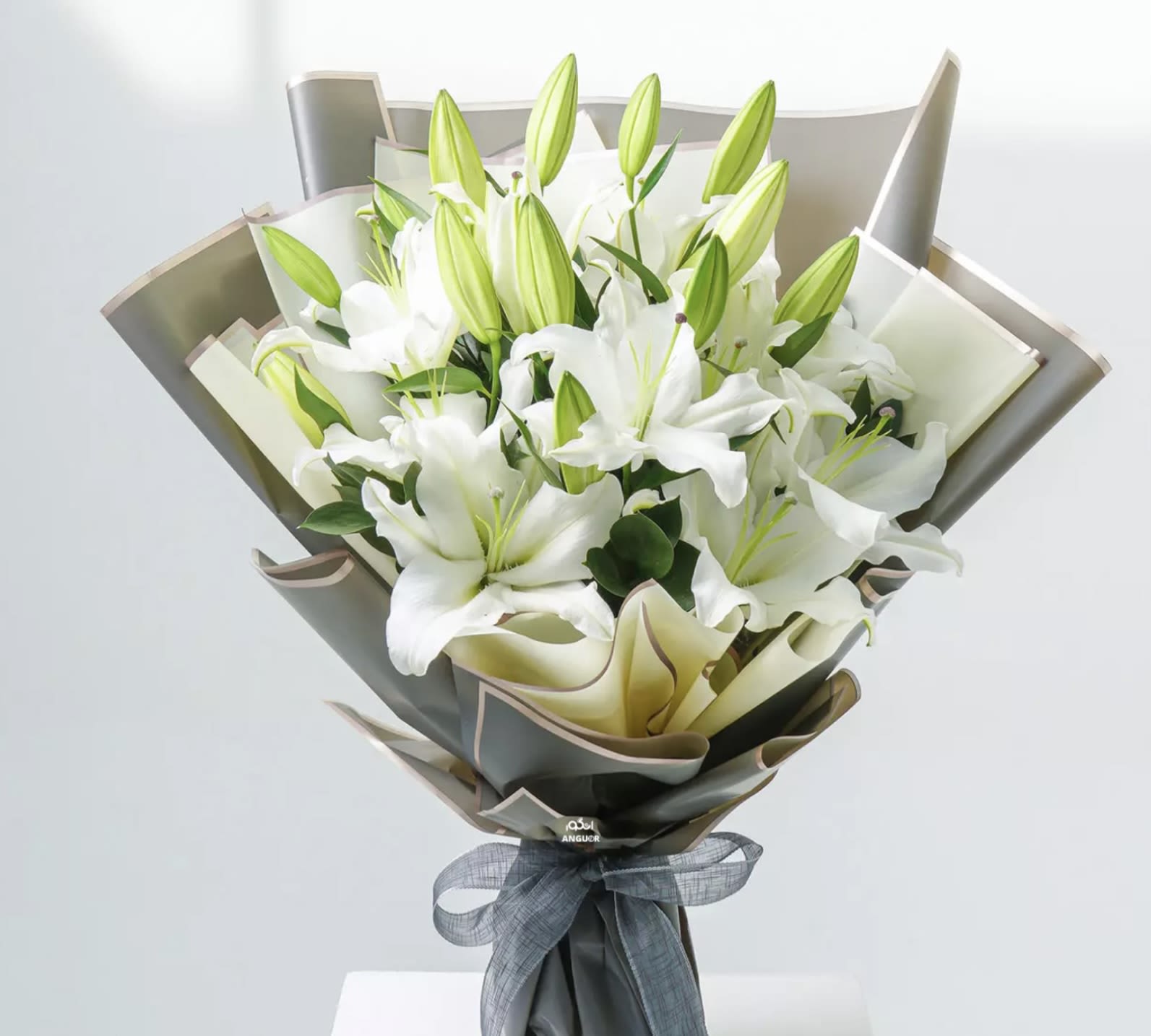 Lilies Bouquet  - Experience timeless elegance with our Lily Boutique, featuring fresh, fragrant lilies arranged with care and sophistication. Known for their beauty and symbolism of purity and devotion, lilies are the perfect choice for celebrating milestones, expressing gratitude, or simply brightening someone’s day. Wrapped in premium paper and finished with a delicate ribbon, this bouquet is a stunning gift for any occasion. Order now and let the grace of lilies leave a lasting impression!