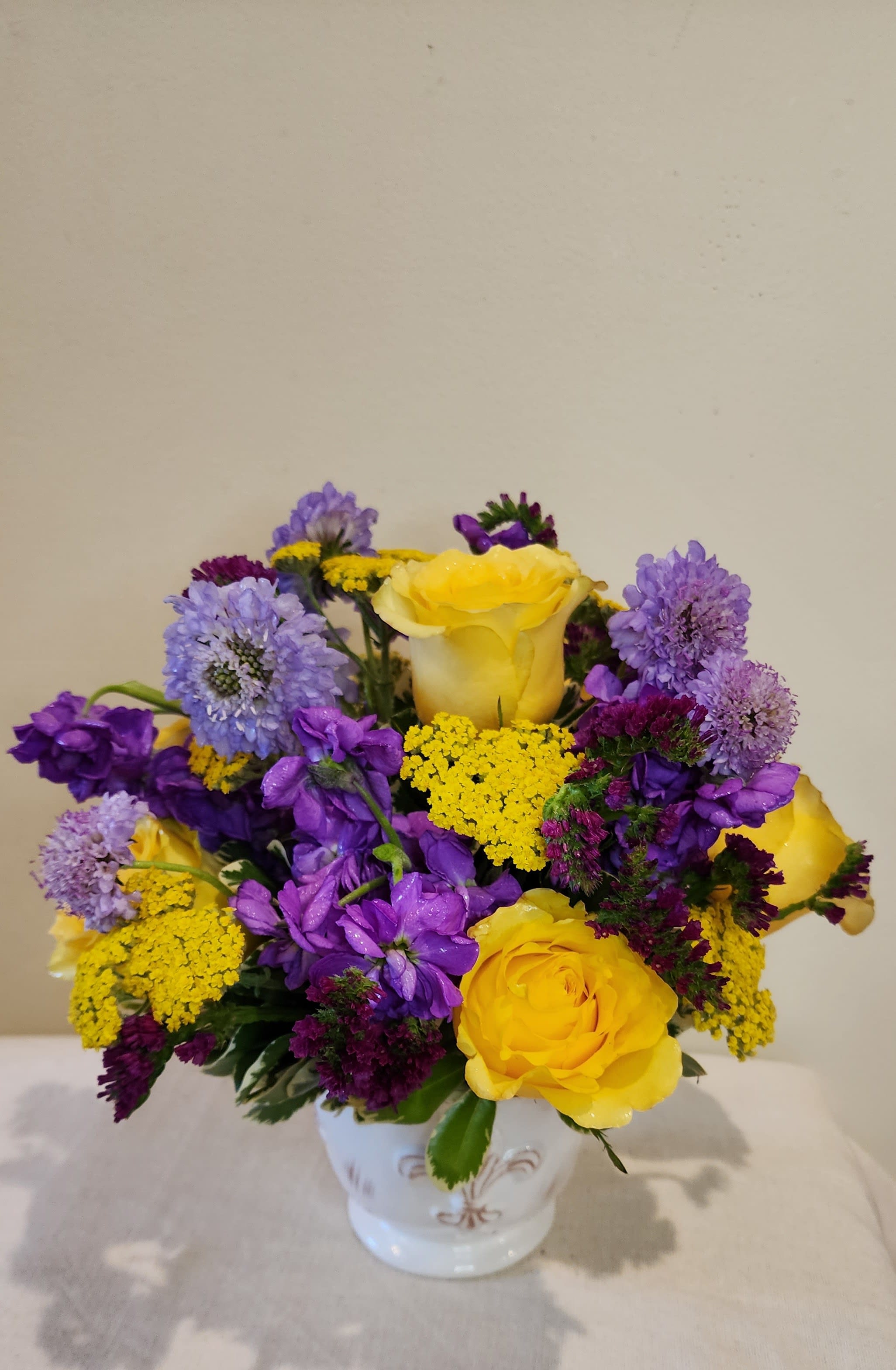 Go Vikes! - This vibrant purple and yellow display is sure to lift anyone's spirits! Fans of the Vikings will appreciate the lovely Fleur de Lis ceramic vase, that can be used again and again.