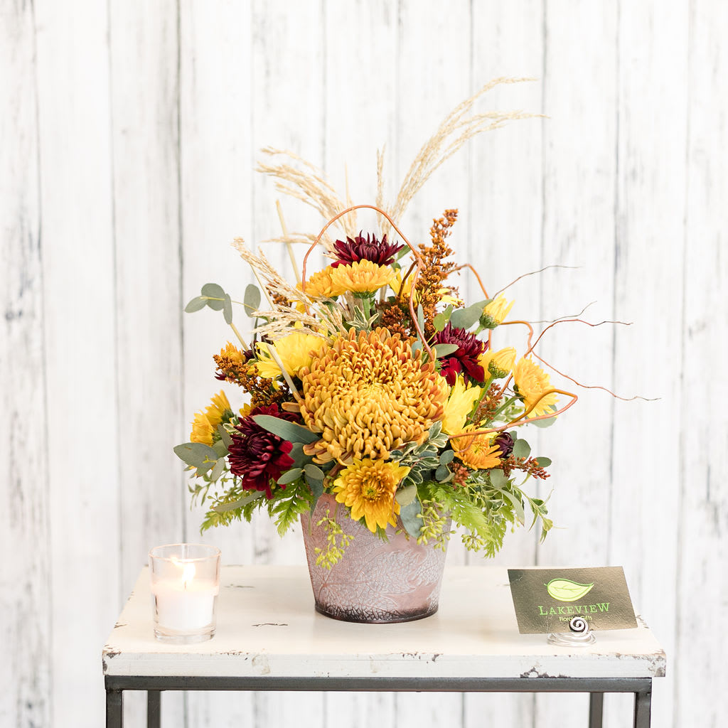 Maple - Golden maple leaves and autumn mums are presented in a tin keepsake vase.  A great gift for home or the office!  Approximately 17&quot; Tall X 11&quot; Wide