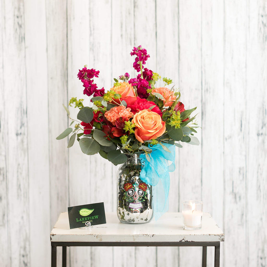 Muerto - Celebrating Dia de Los Muertos or you just are enamored with flowers, enjoy this festive arrangement of roses, alstroemeria and carnations!   Approximate Dimensions: 17&quot; T X 10 &quot; W 