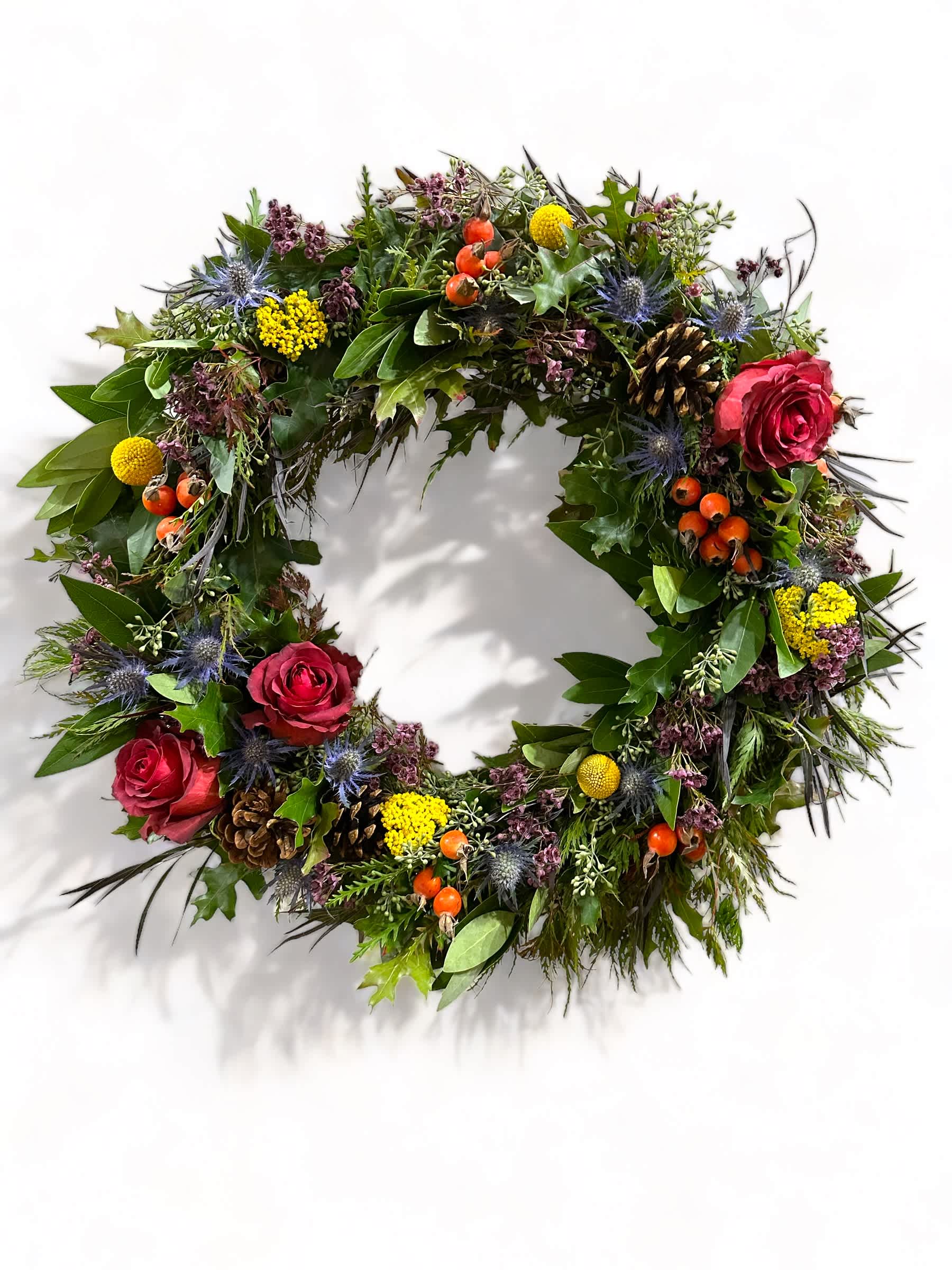 Real Dried Floral Fall Wreath Real Dried Floral Fall Wreath - A beautiful and classy one of a kind wreath that brings the spirit of the season to your front door! Perfect gift for a Fall birthday or as a thank you! 16” diameter. Wrapped in a waterproof cellophane bag! each wreath is hand made and there will be unique and vary slightly from picture but will maintain color palette and fullness. Please request a specific color palette if preferred (orange, red, nudes, blacks)