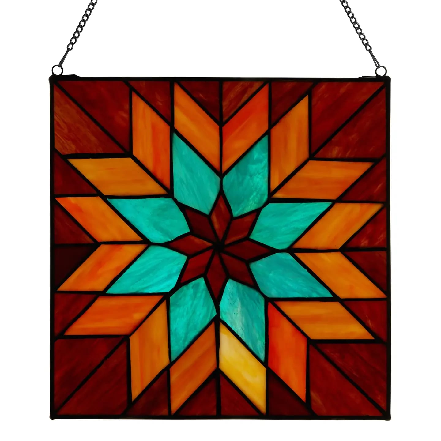 Quilt Square  - Hang this farmhouse-inspired stained glass window panel in any sunny window to create a warm, inviting focal point. Handcrafted from 56 individual glass cuts, this stained glass suncatcher is created by-hand using the copper foil soldering method for a unique look. It features a quilt-like geometric floral design in red, teal and orange hues that become more vibrant when light passes through the glass. Plus, the stained glass suncatcher comes with an attachable decorative hanging chain for easy display in your living room, dining room or entryway. Perfect addition to your fall decor. Overall Dimensions: 12&quot;L x 0.25&quot;W x 12&quot;H Stained glass window panel with 56 individual glass cuts.