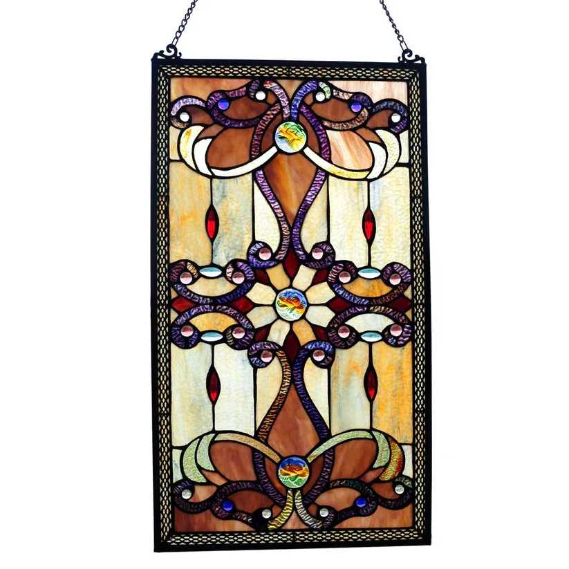 Wyatt Amber Window Panel - Expertly crafted from 206 pieces of hand cut stained glass in neutral tones with pops of red, purple, and yellow. 32 glass cabochons and 3 hand poured glass rosettes add texture and shine as they reflect the sunlight. Glass variations, such as high-end ripple glass and striated glass are soldered together to form delicate ribbons of color. A basket weave filigree frames each side.  26&quot; x 14&quot;