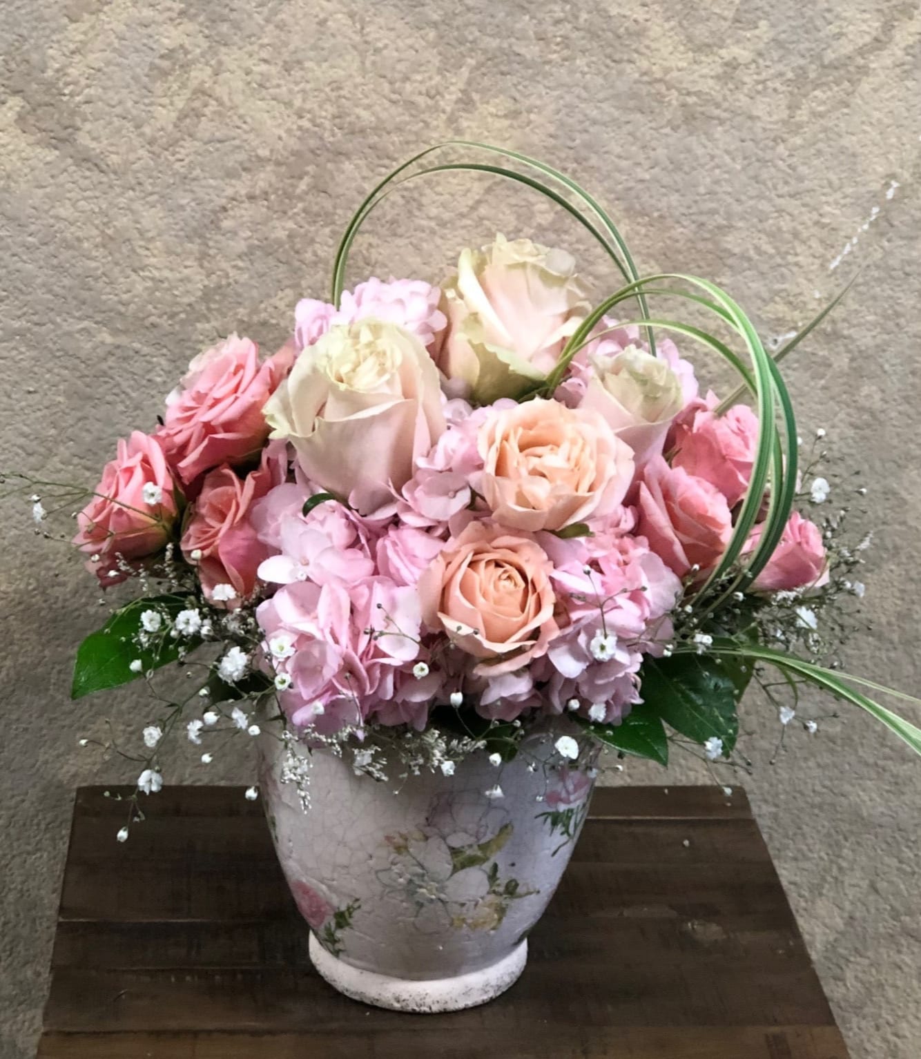 Special Surprise - A sweet garden bouquet great surprise for Mom or new baby.Type of Flowers: Variety of Pink Regular and Spray Roses and Pink Hydrangeas in a ceramic pot with floral design. Availability: All year round Substitute Available: Yes Photo shown: Regular