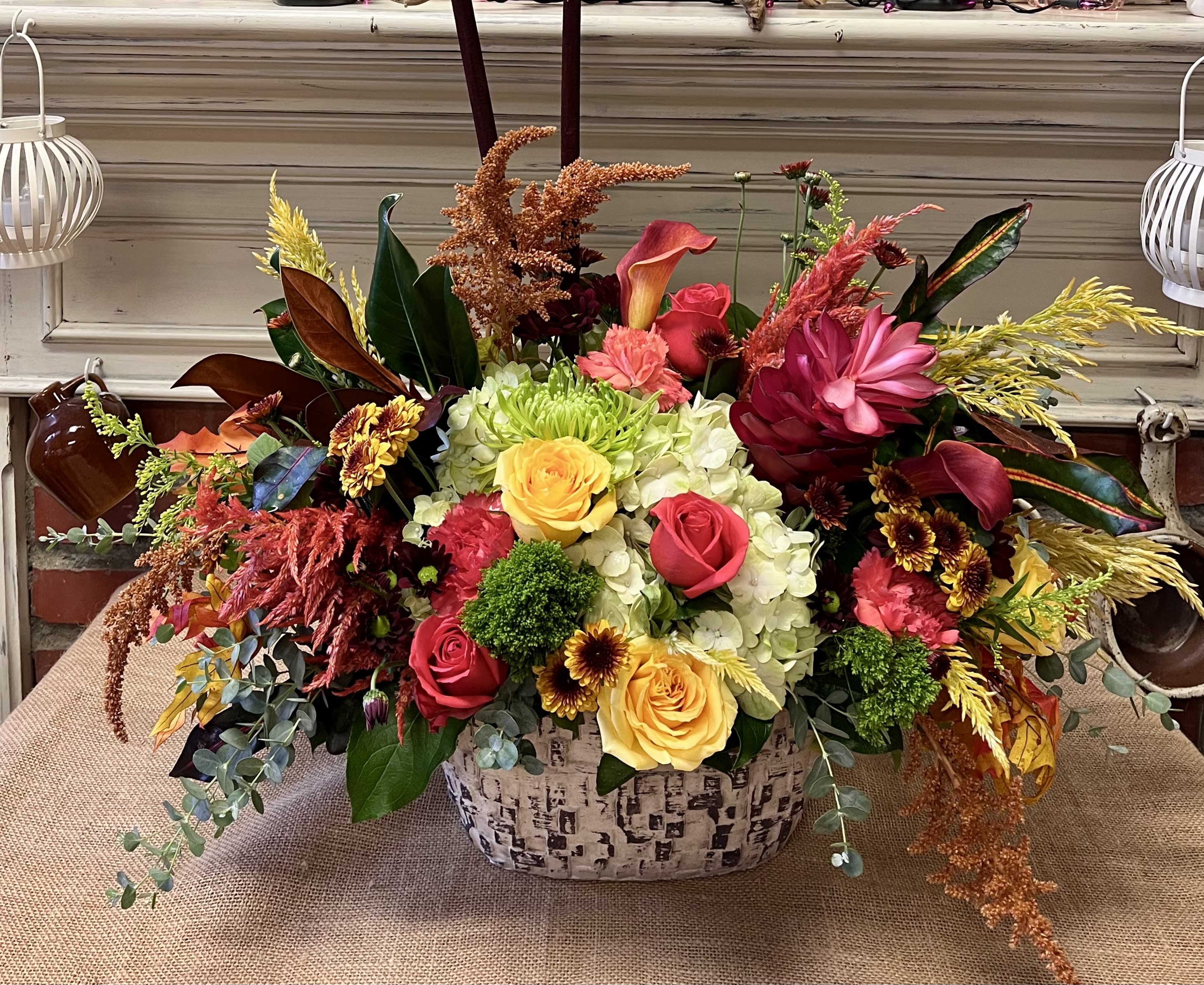 Joyous Gathering Joyous Gathering - Recipe: Chrysanthemums, Roses, Snapdragons, Protea, Hydrangeas, Fuchsia Amaranthus, Stock, Daisies, Eucalyptus and more in a white oval, ceramic vase. Availability: All year round Design View: Symmetric Front Facing View Photo shown: Standard